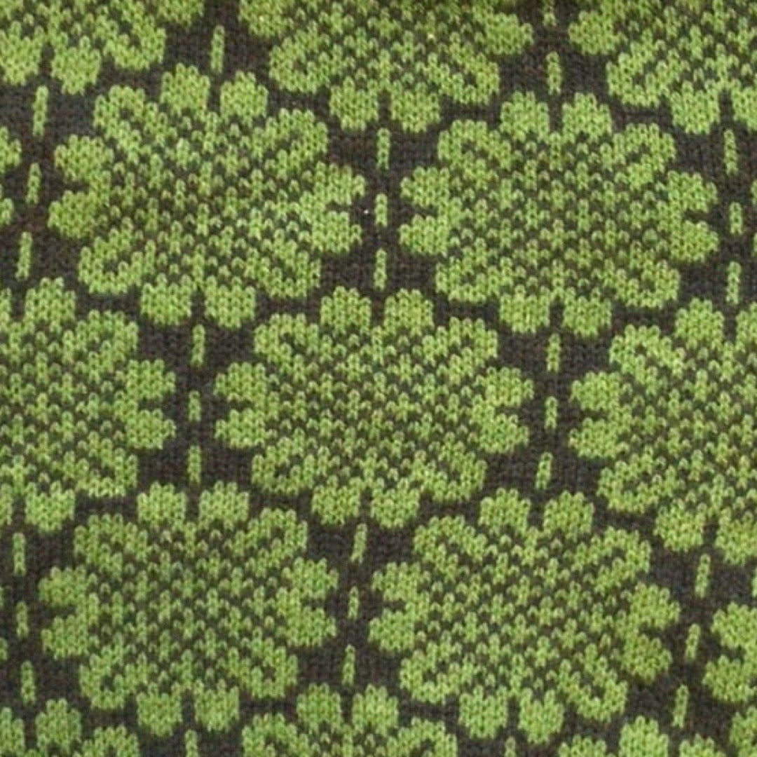 A soft and cosy 100% lambswool knitted snood in a green daisy design.
