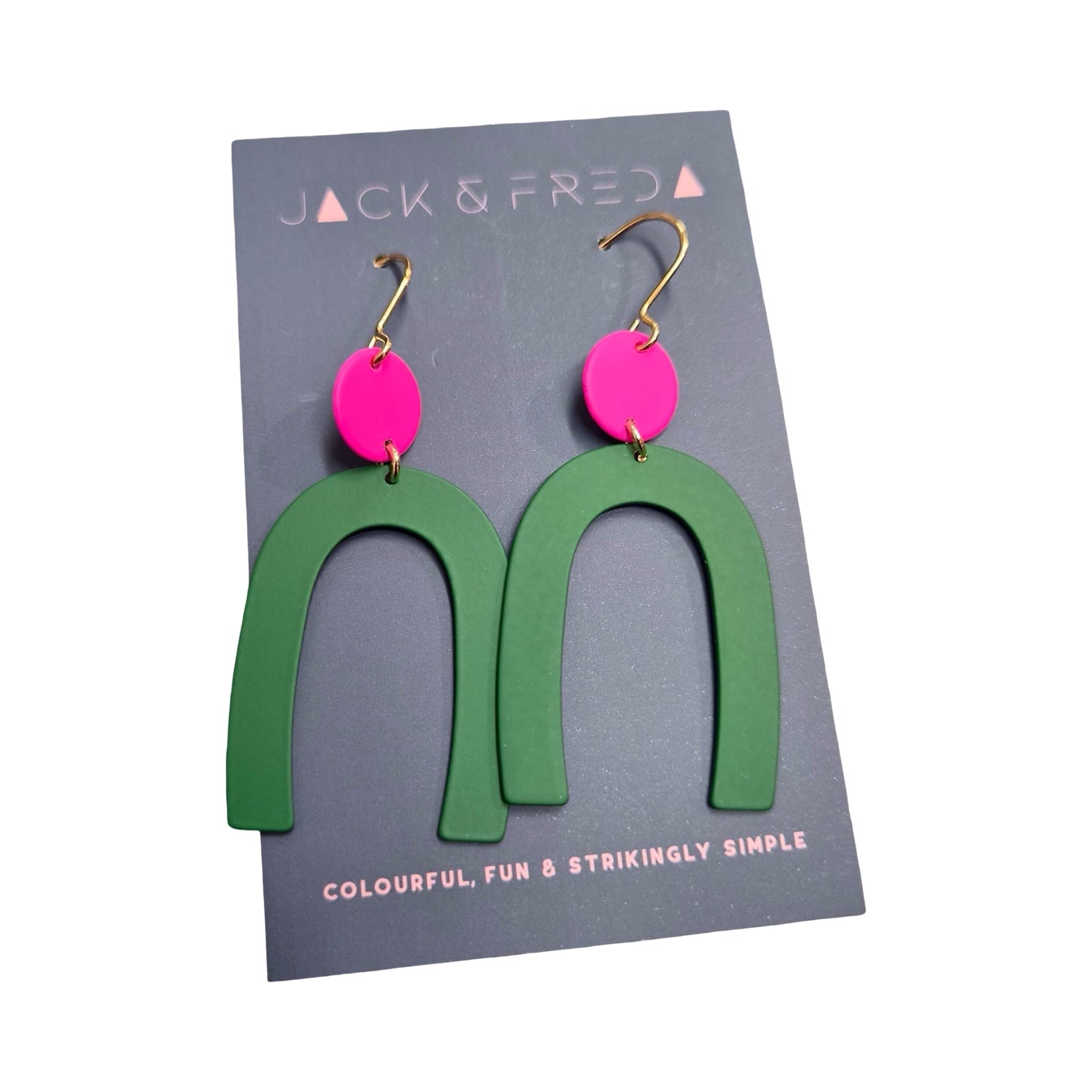 Green arch-shaped earrings with pink circular pendants on a Jack & Fred card.