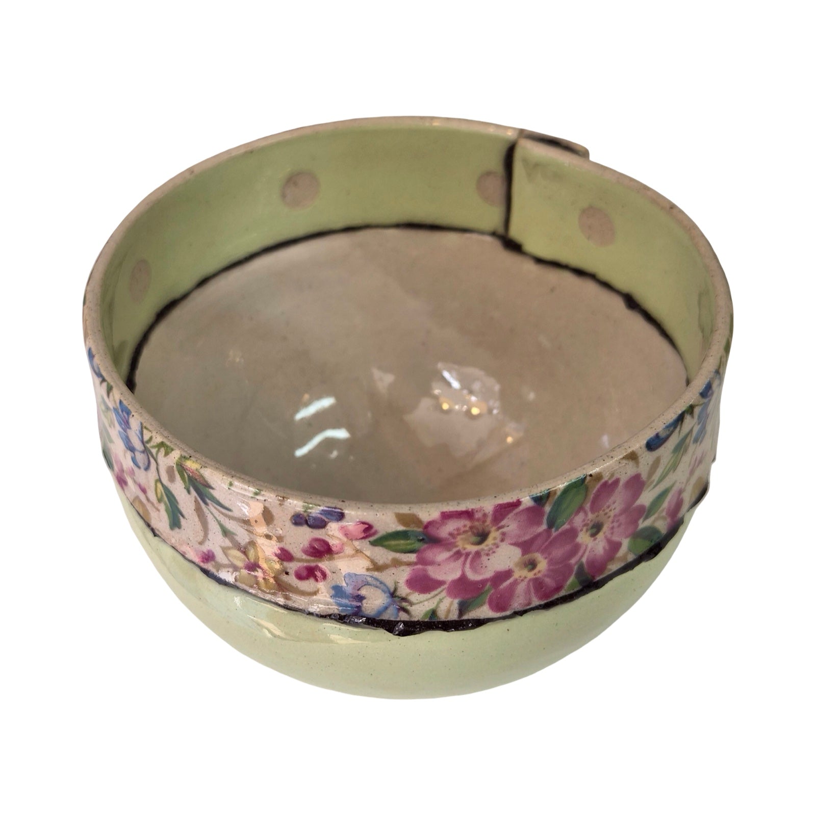 Ceramic bowl with floral pattern on a white background.