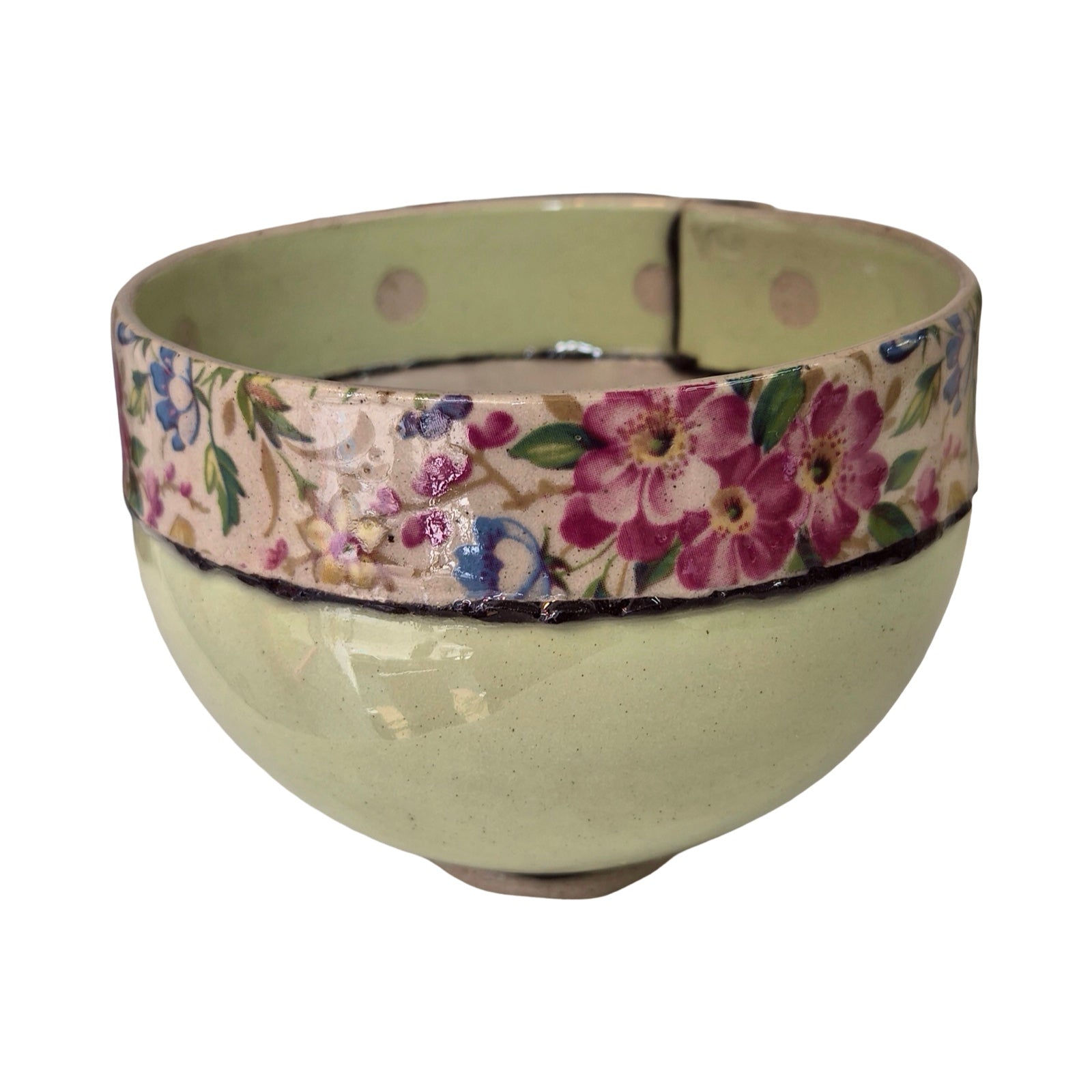 Ceramic bowl with floral band on a white background.