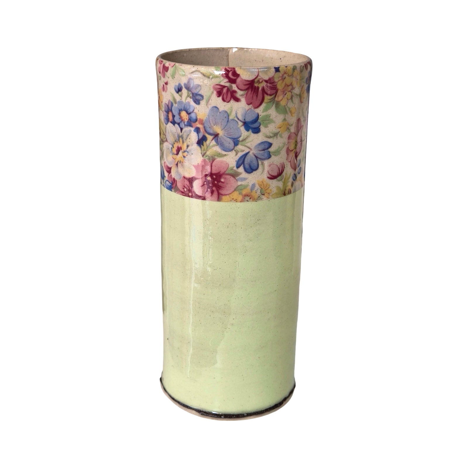 Cylindrical vase with floral pattern on a white background.