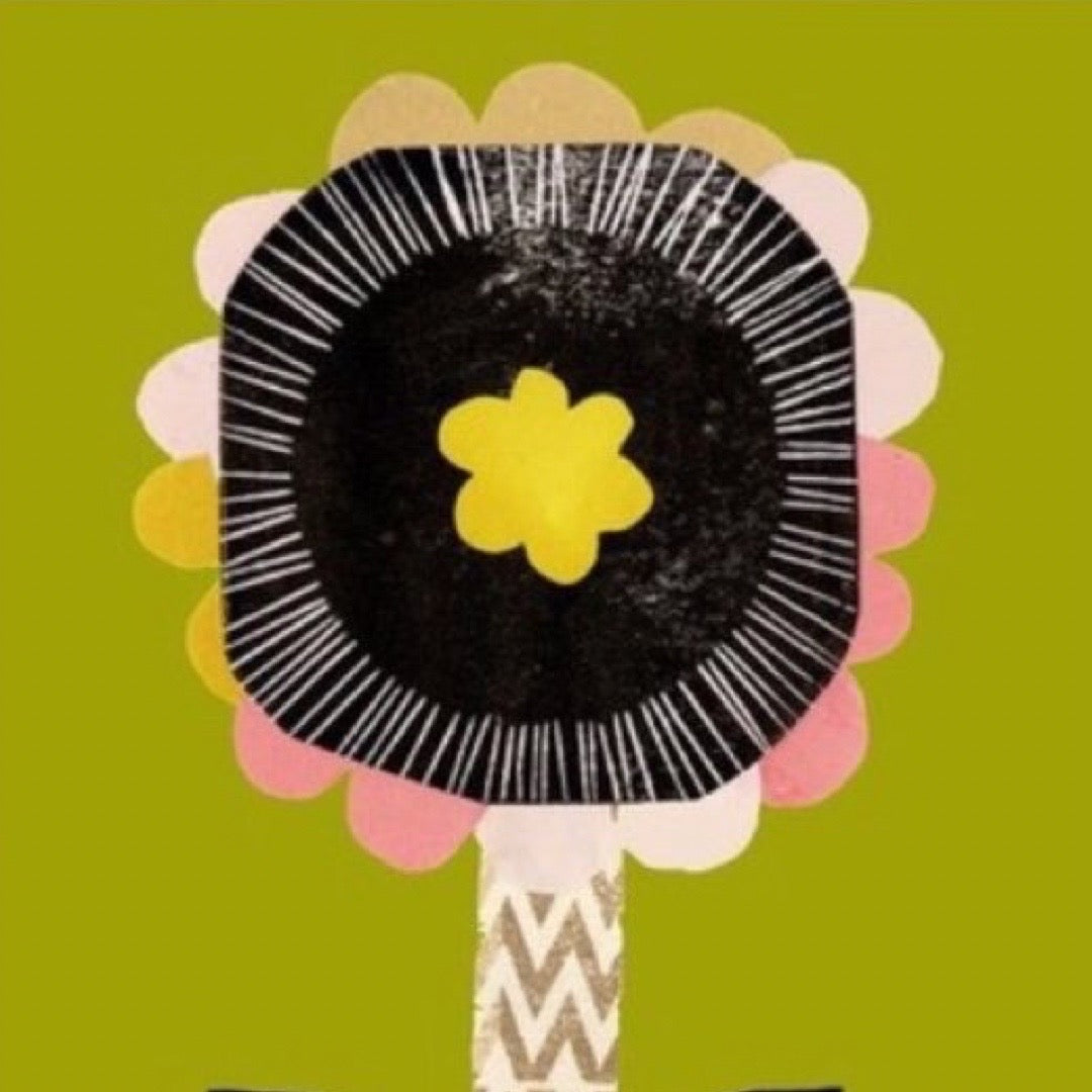 Floral design with a black center, yellow flower, and pink petals on a green background.