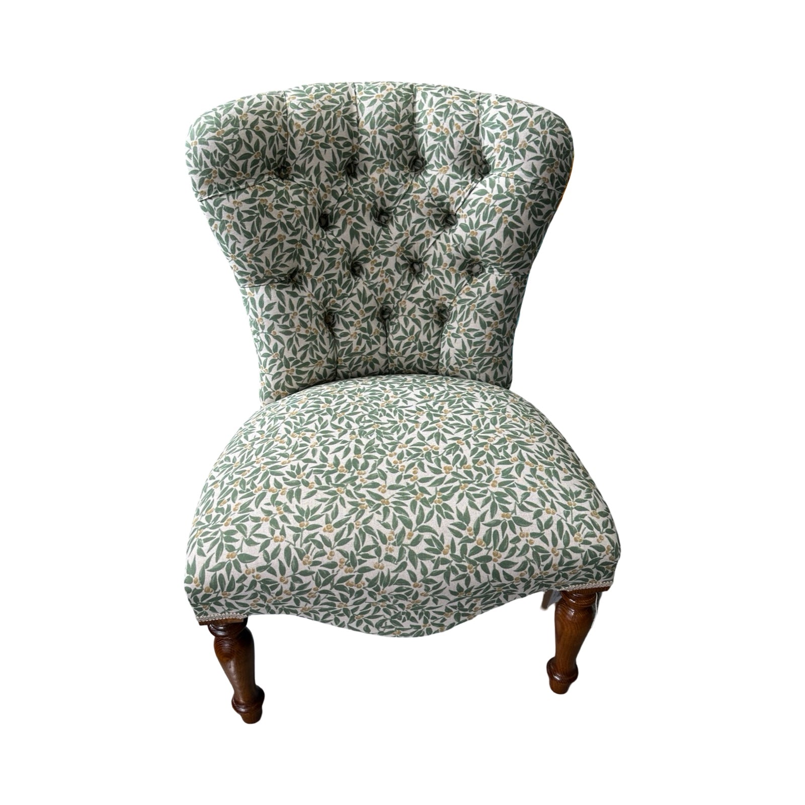 Patterned chair with floral design on a white background.