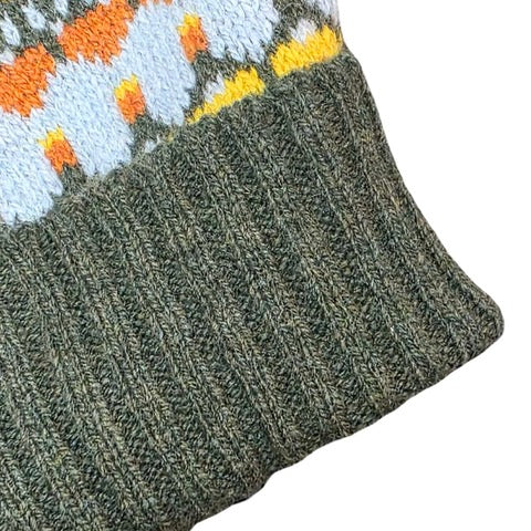 This green, orange, blue and yellow striped woollen hat is handmade using only the softest Scottish spun lambswool.