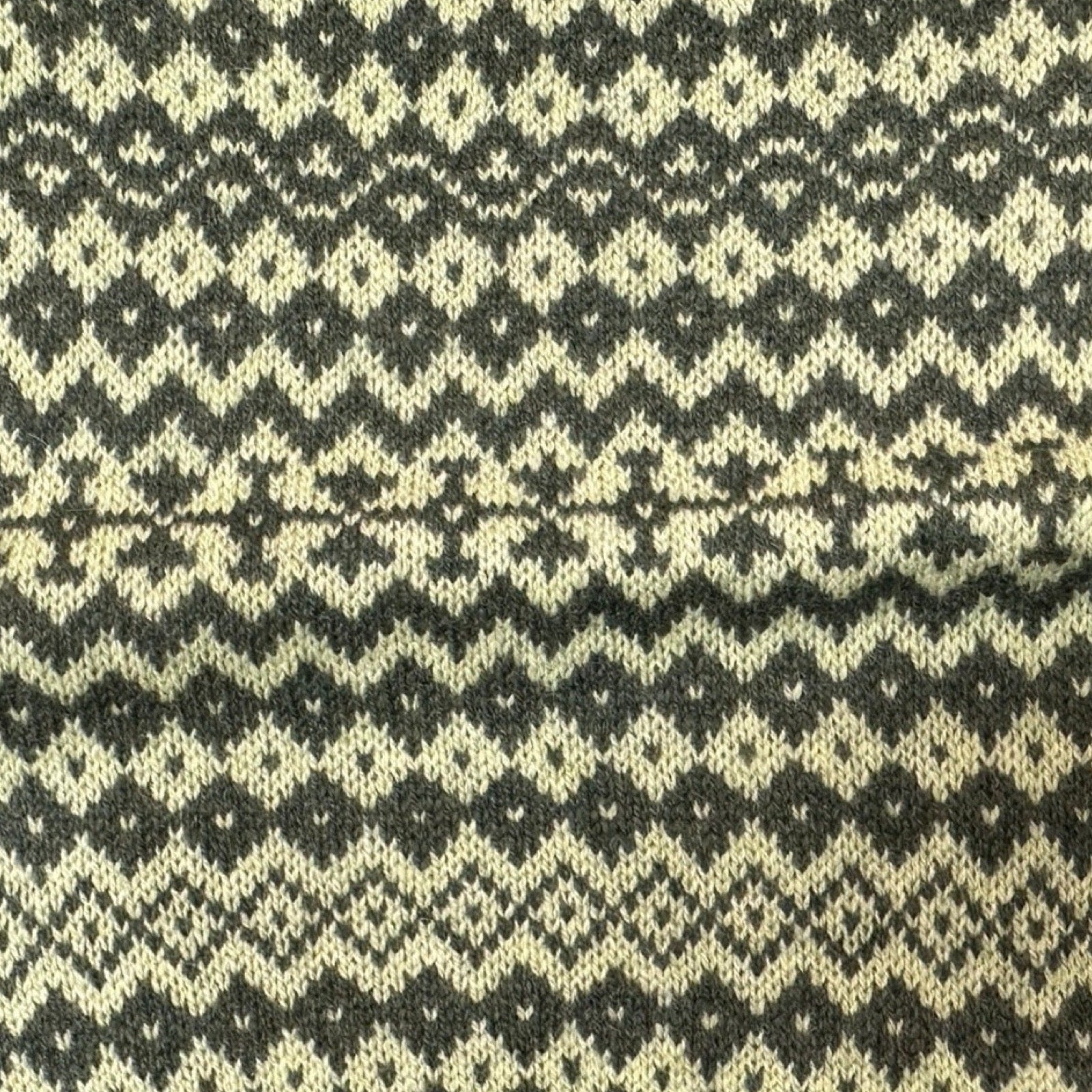 Super soft and cosy 100% lambswool knitted snood in a green geometric stripes design.