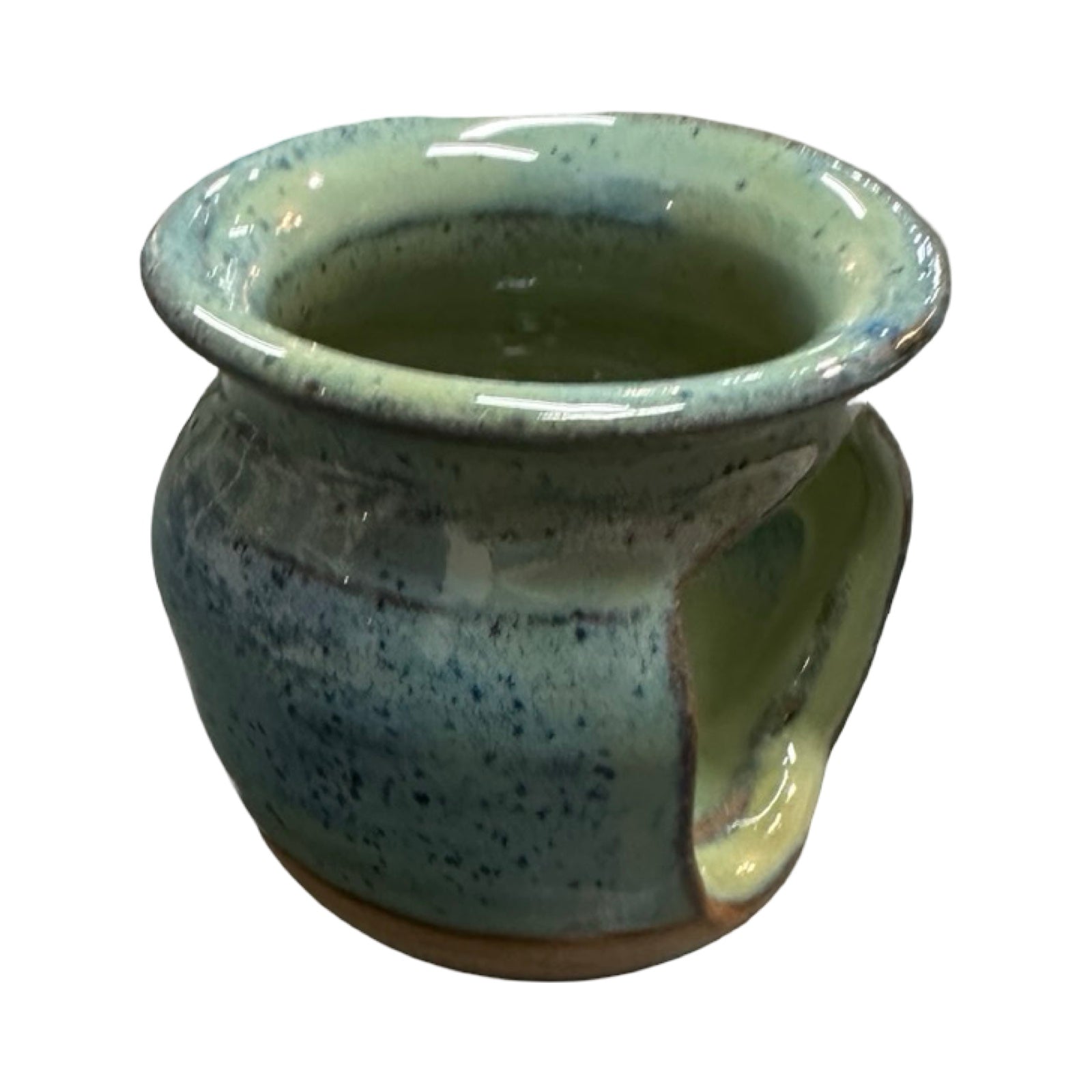 Speckled green ceramic oil burner on a white background.