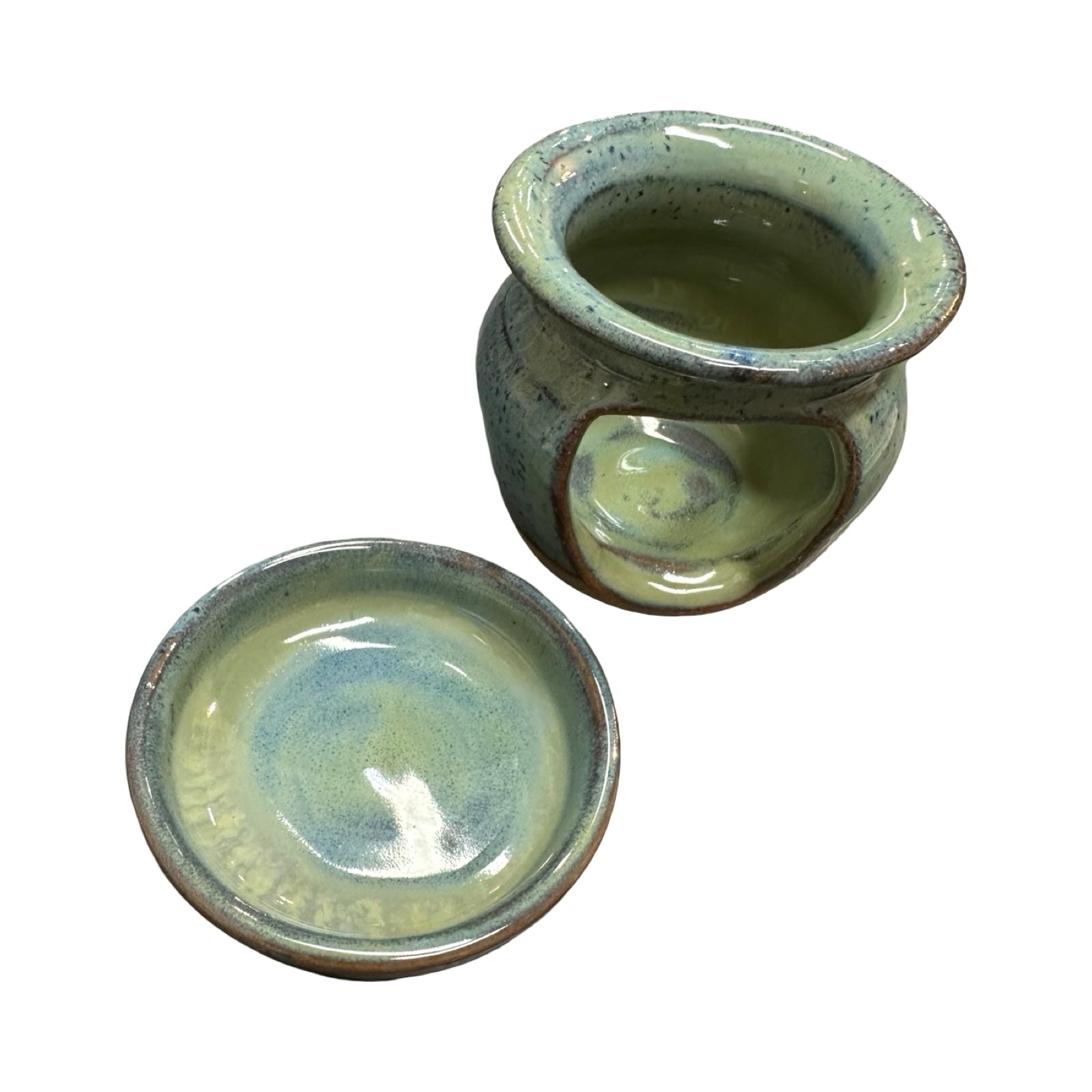 Ceramic oil burner and top with green and blue glaze on a white background.