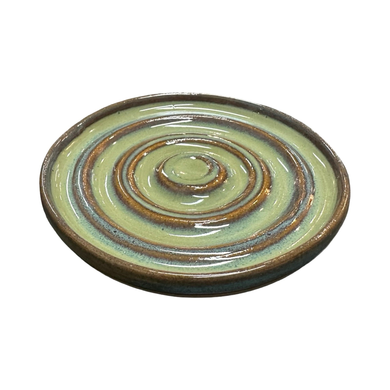 Ceramic dish with concentric circle design on a white background.