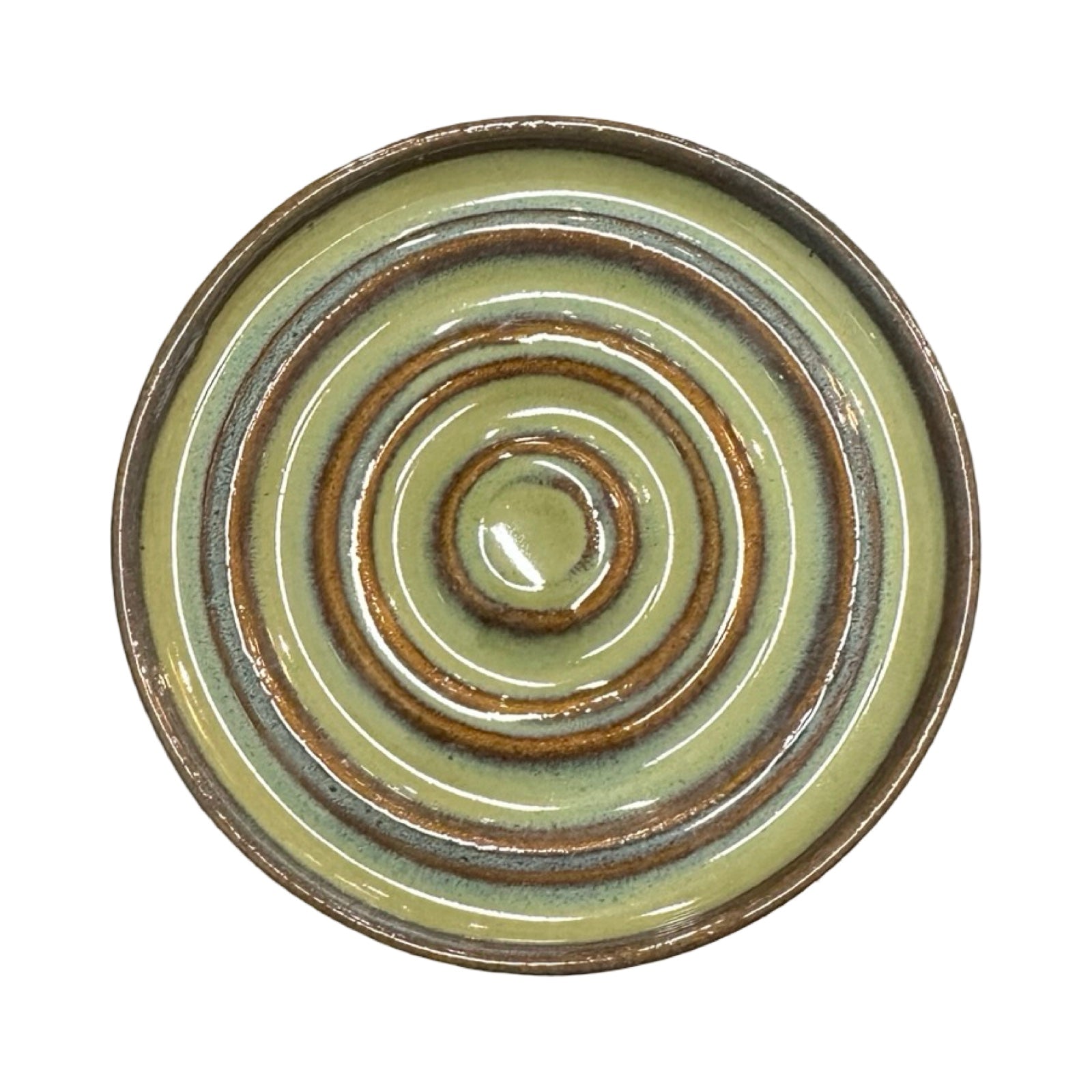 Ceramic dish with concentric circular design on a white background.