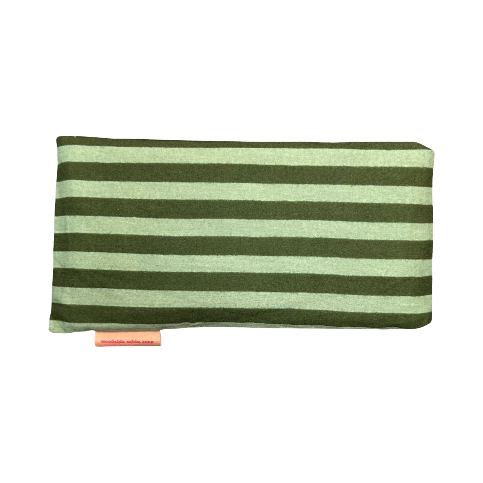 A rectangular eye pillow with horizontal stripes in olive green and light sage green, featuring a small pink tag at the bottom left.