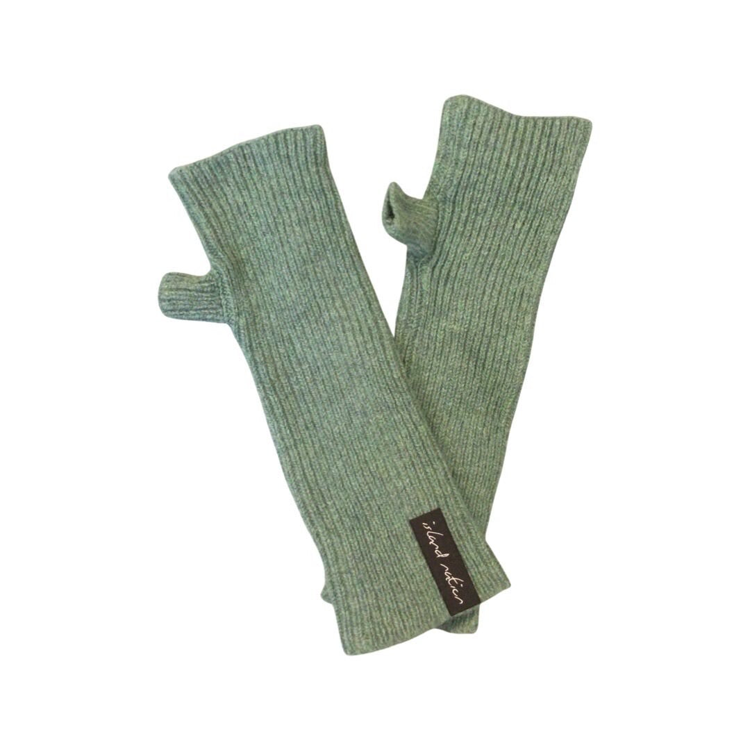 Ribbed woollen wrist warmers knitted using 100% British lambswool in green. 