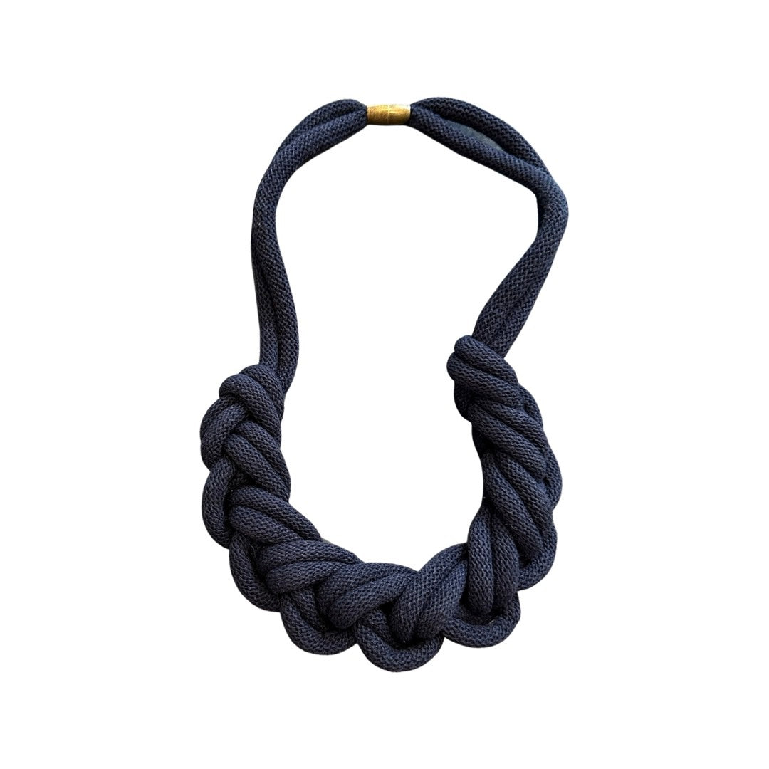 A hand-knotted, lightweight, grey, braided-style necklace.