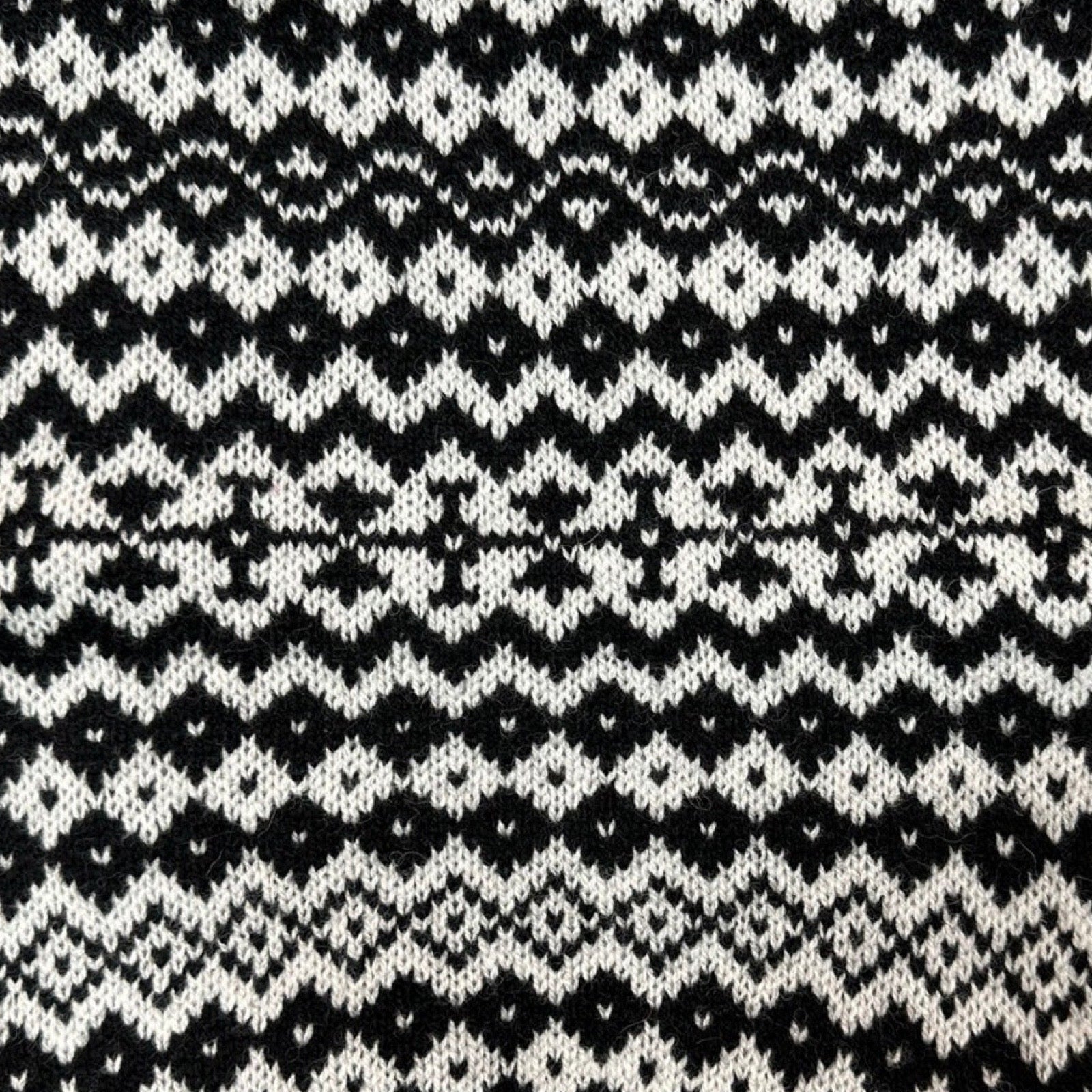 Super soft and cosy 100% lambswool knitted snood in a grey and black geometric stripes design.