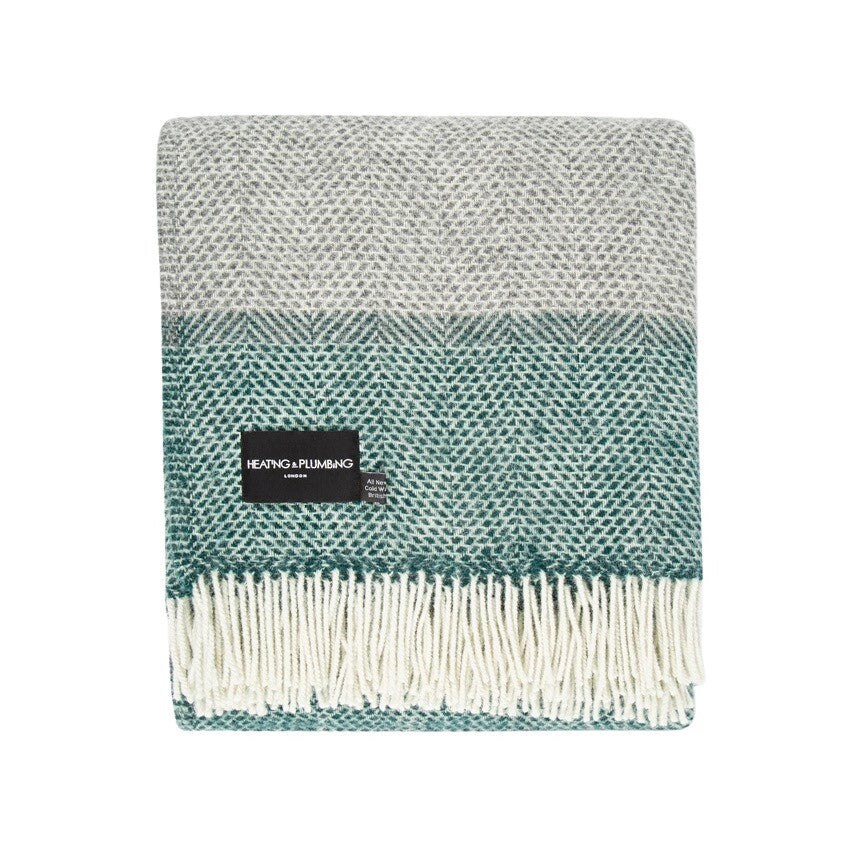 This grey and green striped super cosy and fluffy blanket is made from 100% pure new wool and finished with extra brushing to make it super soft.