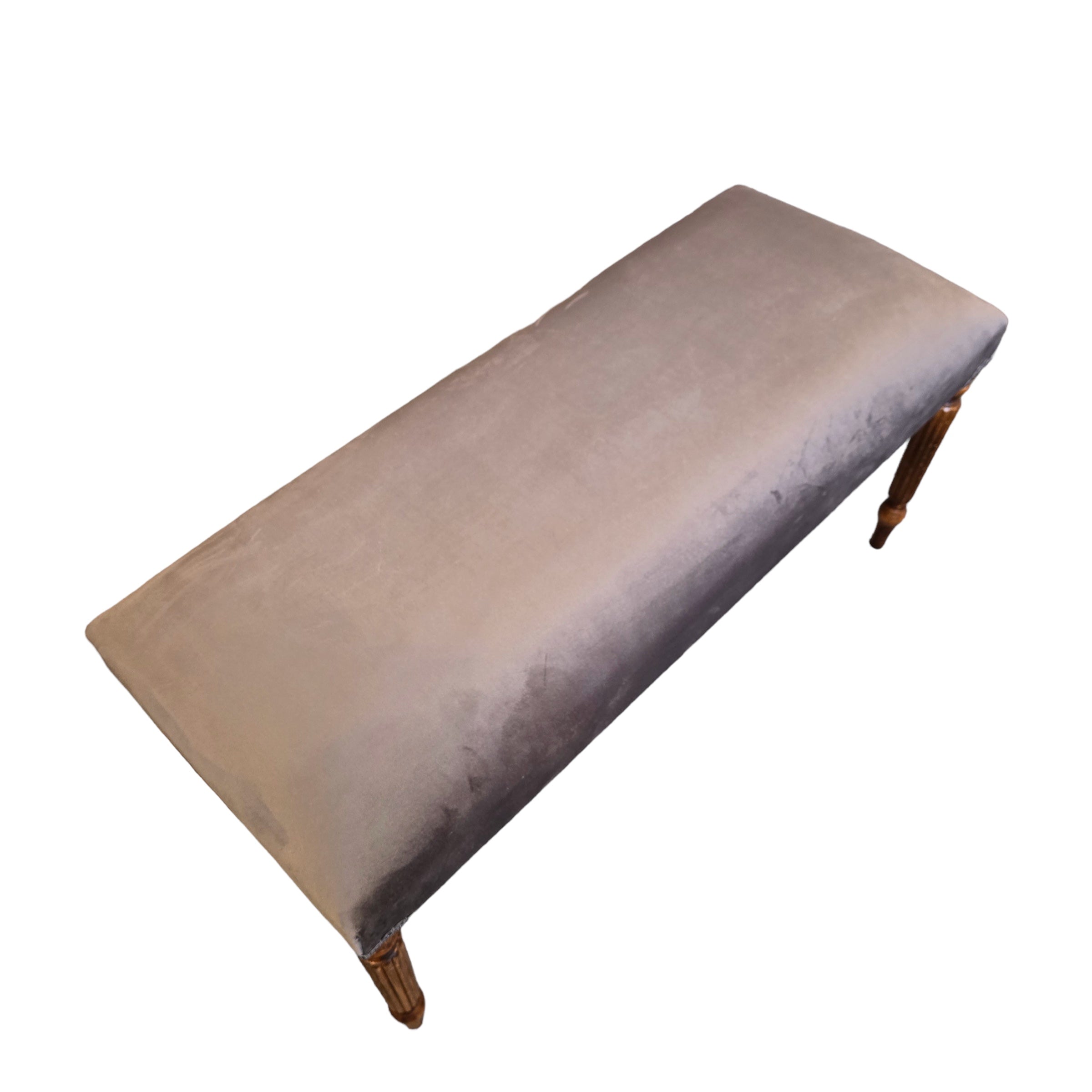 A rectangular velvet bench with mahogany stained legs in a grey colour design.