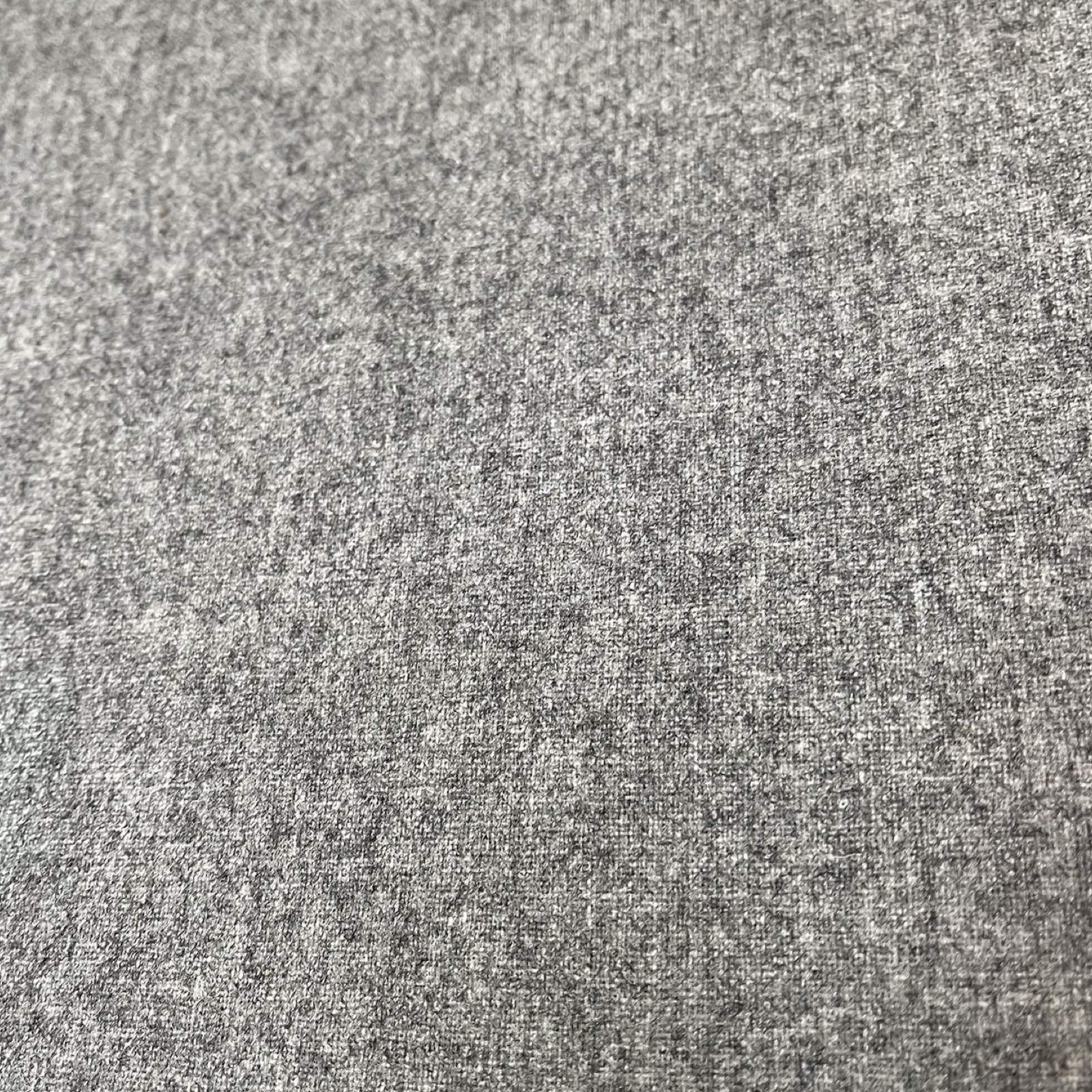 A rectangular grey wool bench.