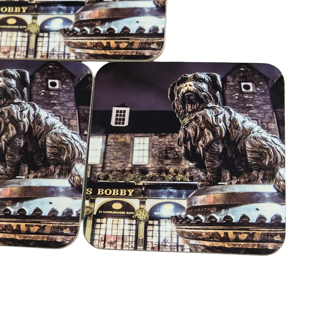 Coaster set with a dog statue and building.