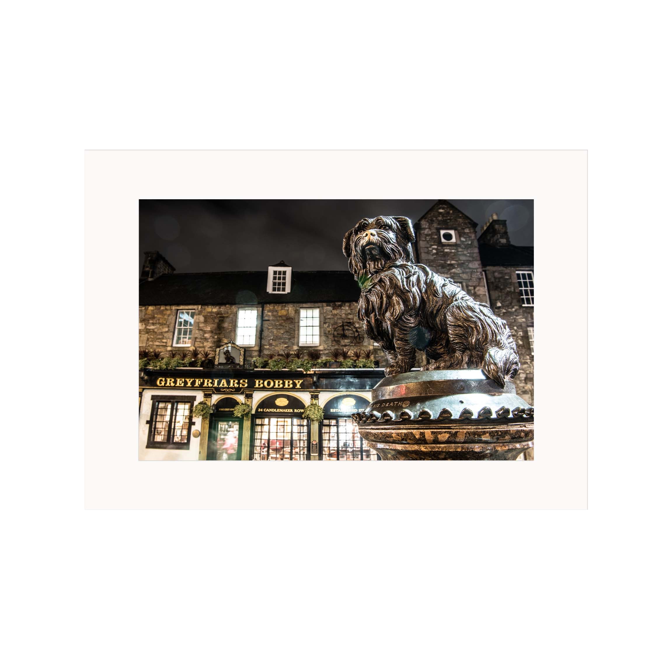 An image of the Greyfriars Bobby statue in a rectangular mounted print. 