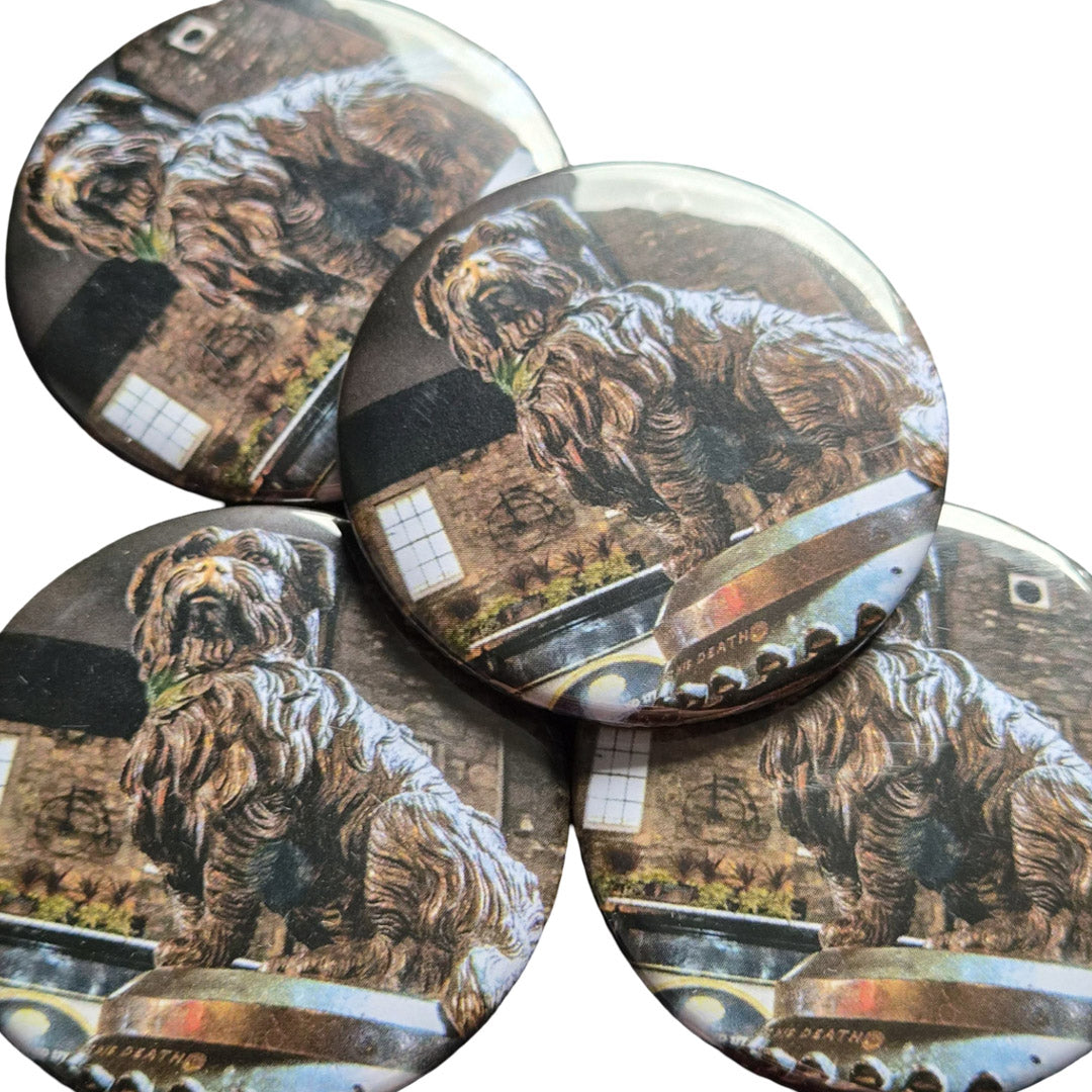 Set of round magnets with a dog statue and building background