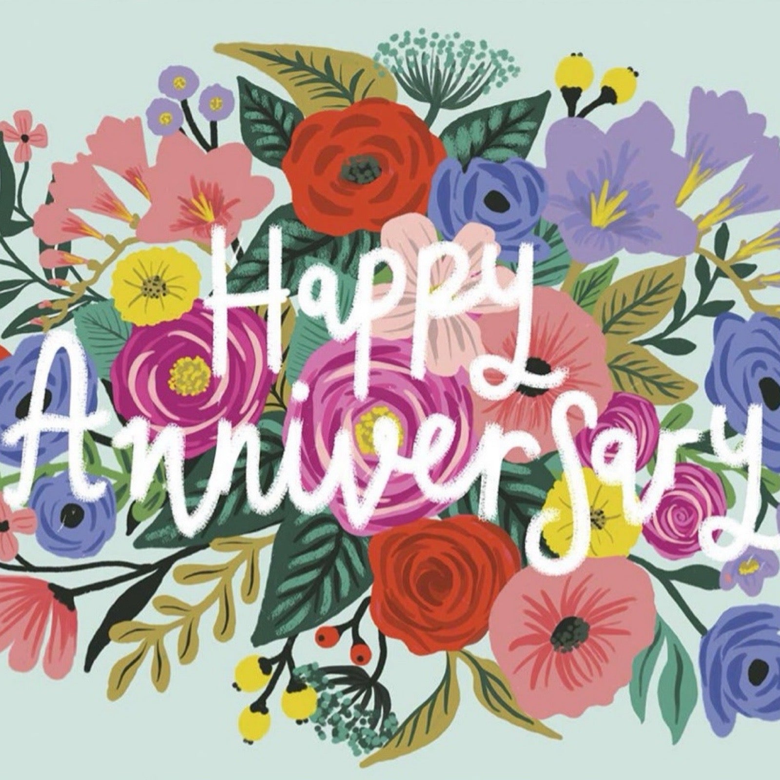 Anniversary card featuring a colourful bouquet on a pale blue background and the text 'Happy Anniversary' handwritten in white in the centre.