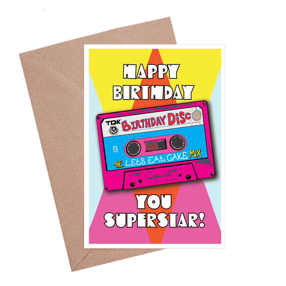 Birthday card featuring a mix tape with the name 'The lets eat cake Mix' with a pink and yellow geometric background