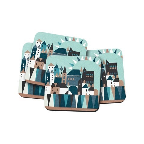 A set of four coasters featuring an abstract design of a harbour wall with a town above in shades of turquoise, brown and white.