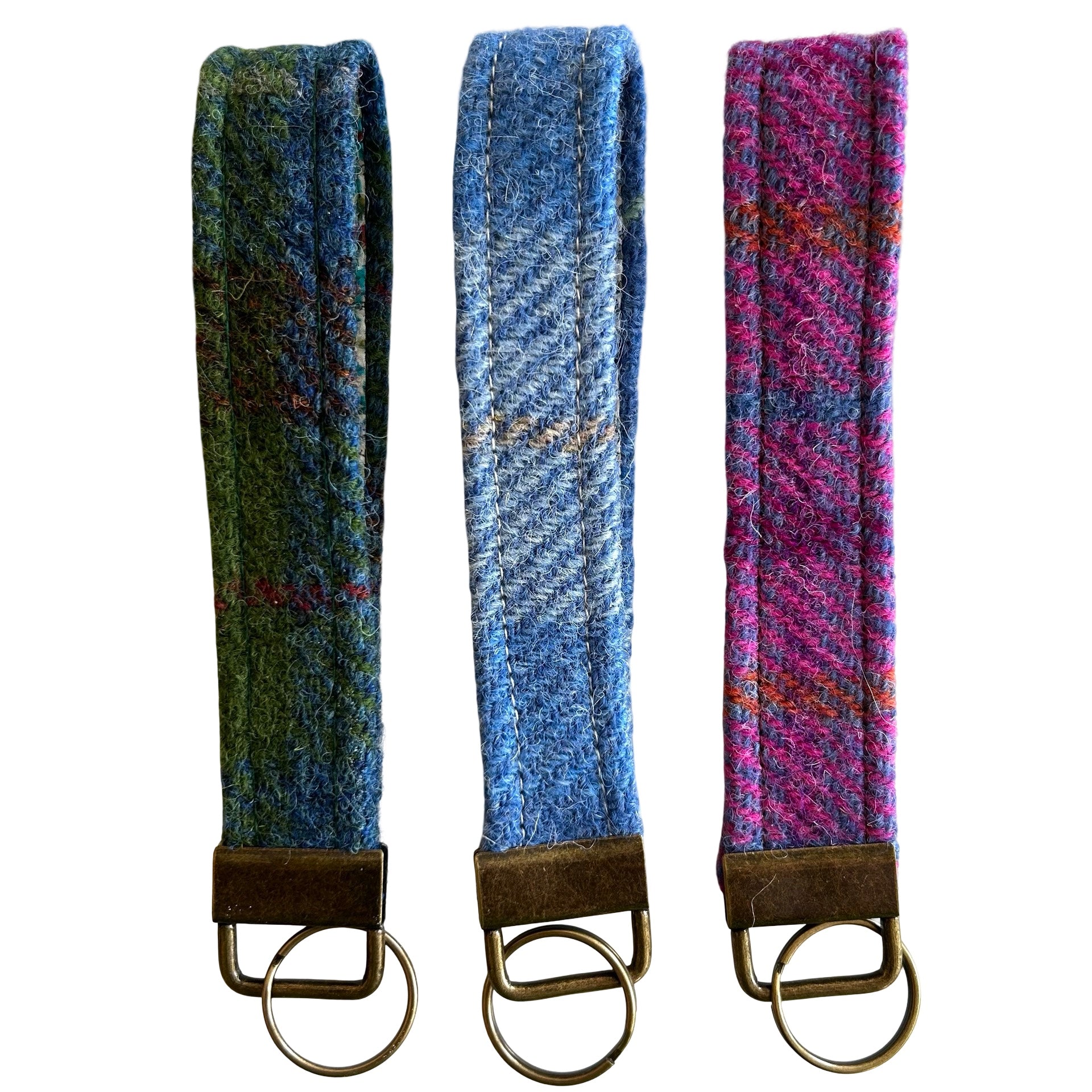 Three tweed wrist loop key rings with metal ring attachment.  One is blue tweed, one purple and one green.