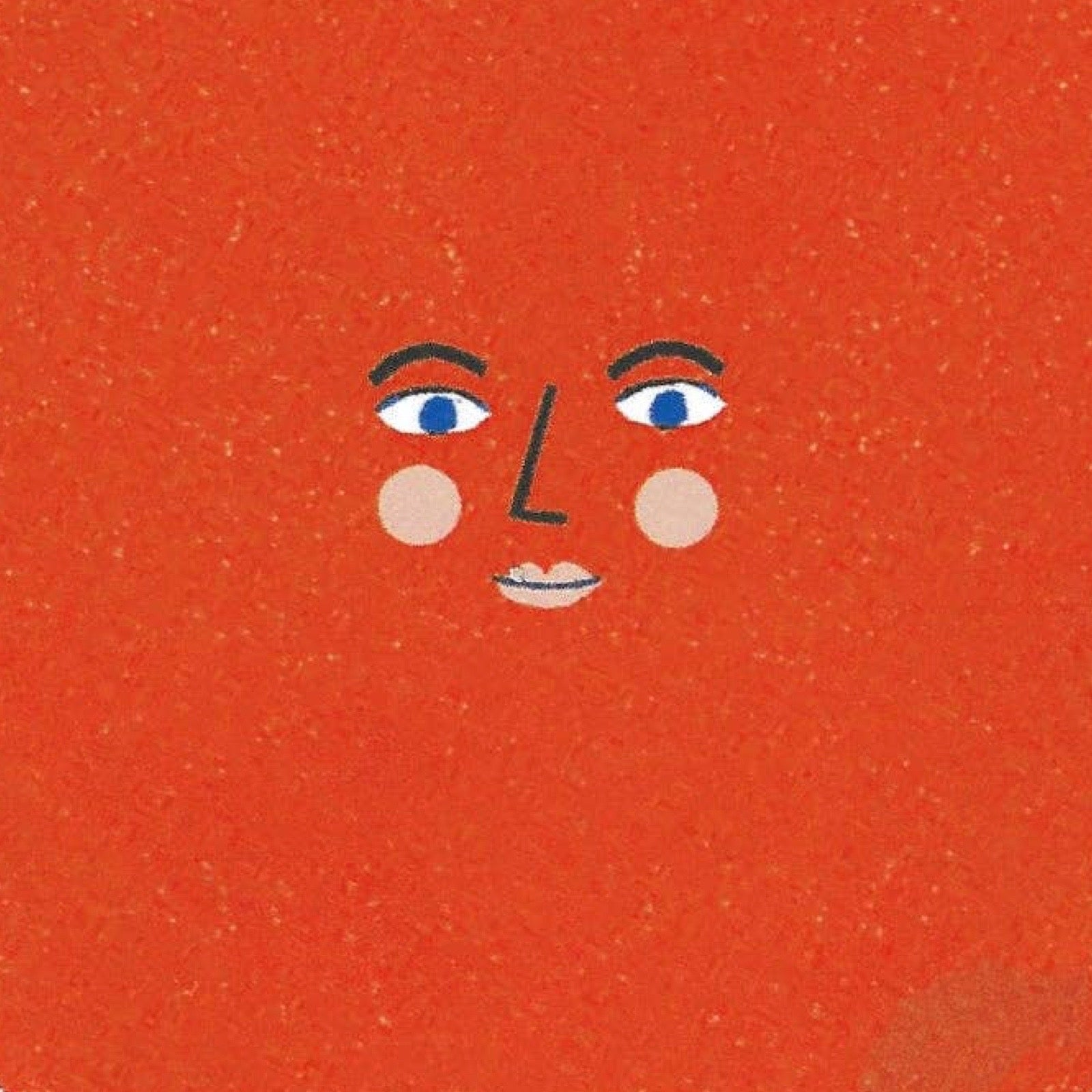 Close up of sticker with a face on a red background.