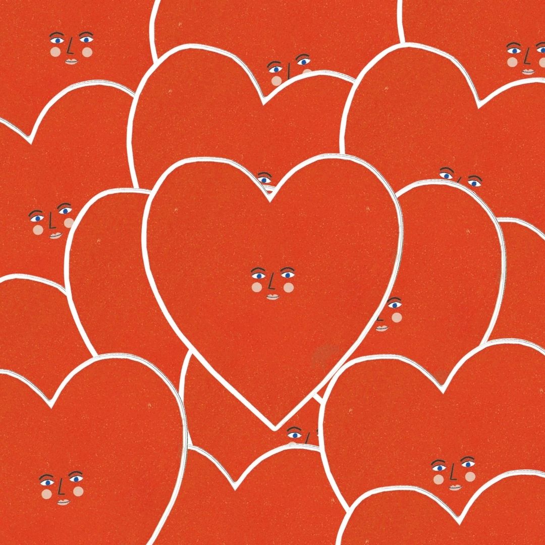 A pile of heart face stickers.