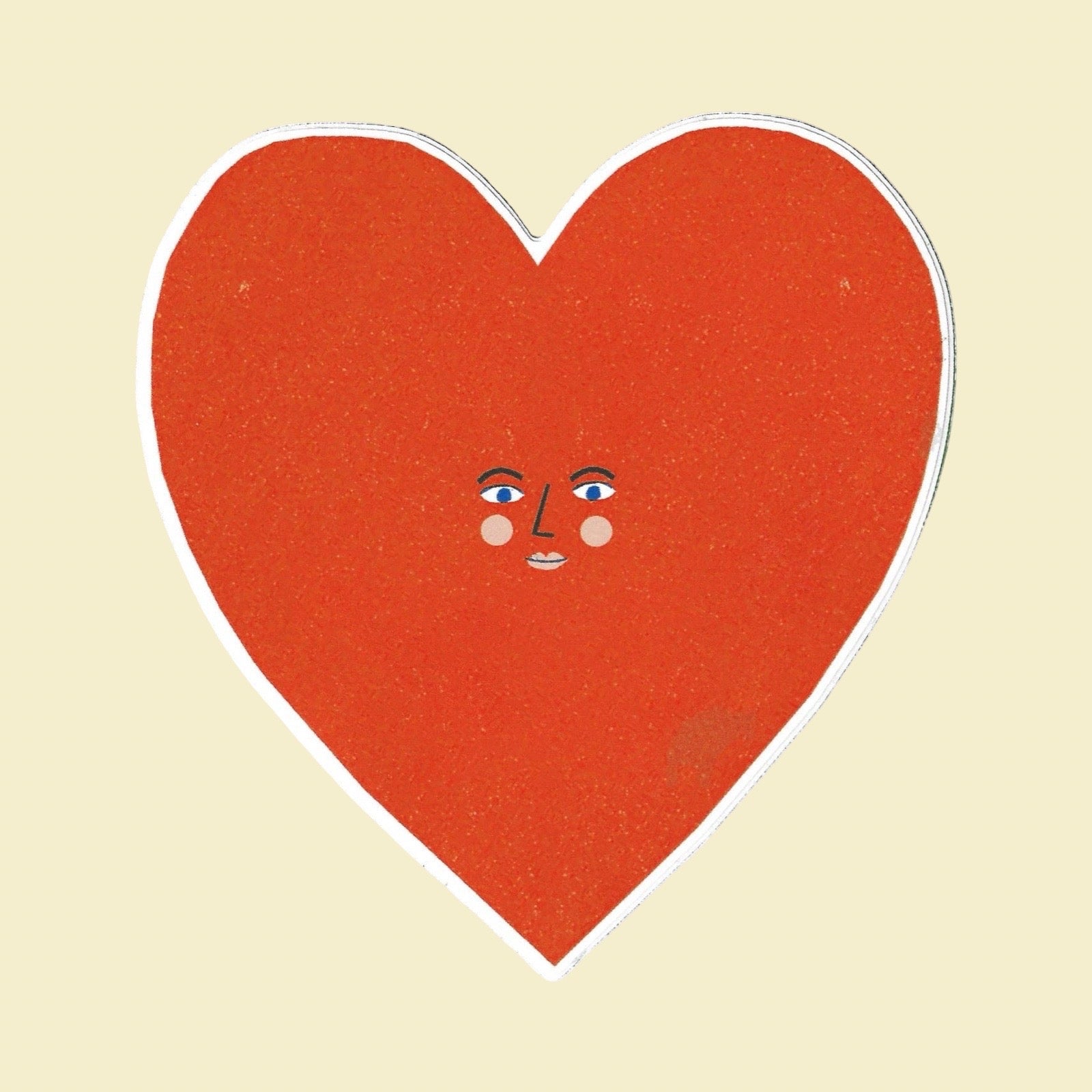A heart-shaped red sticker with a white border and a small cute face in the centre, set against a solid pale yellow background.