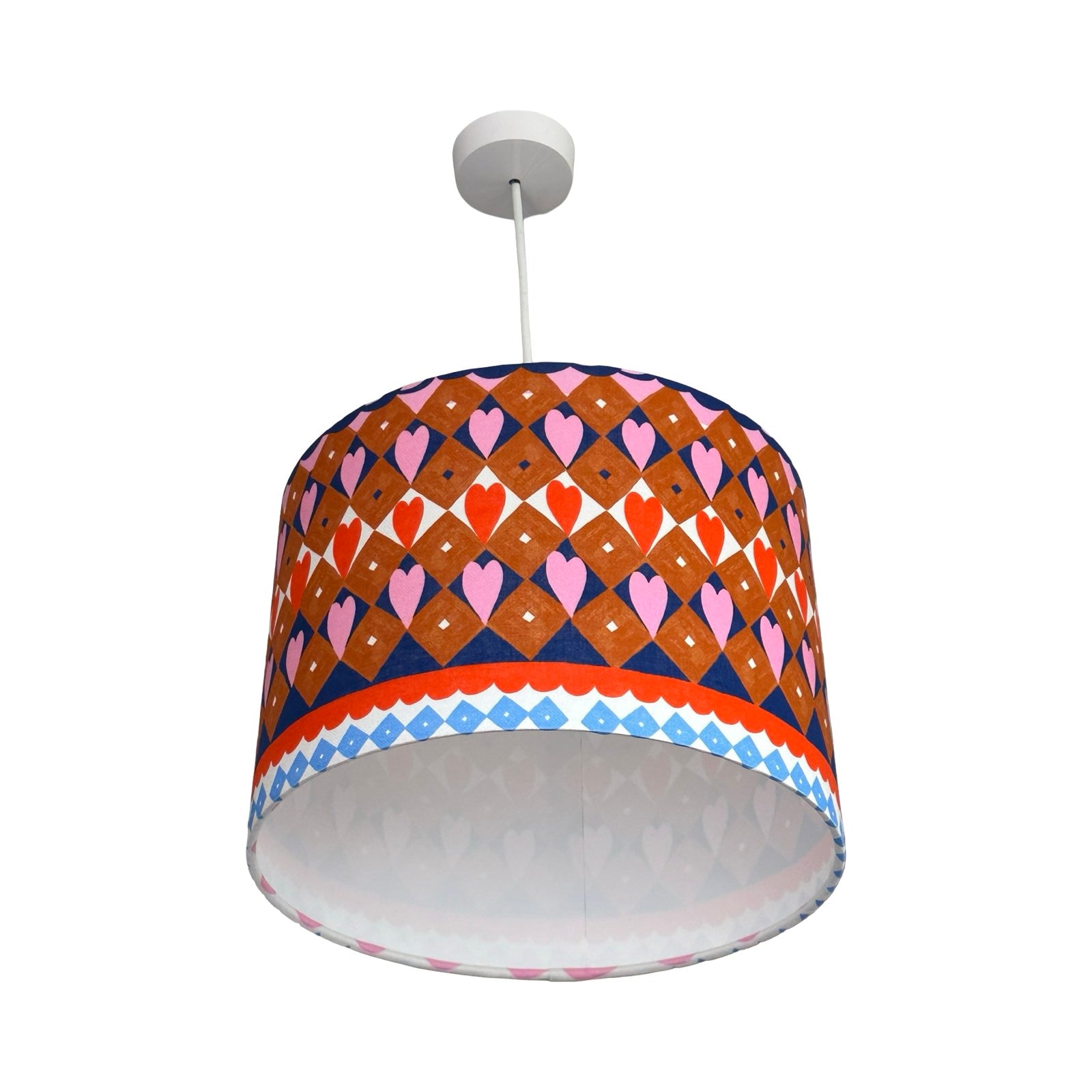 Colorful patterned lampshade on a white background.