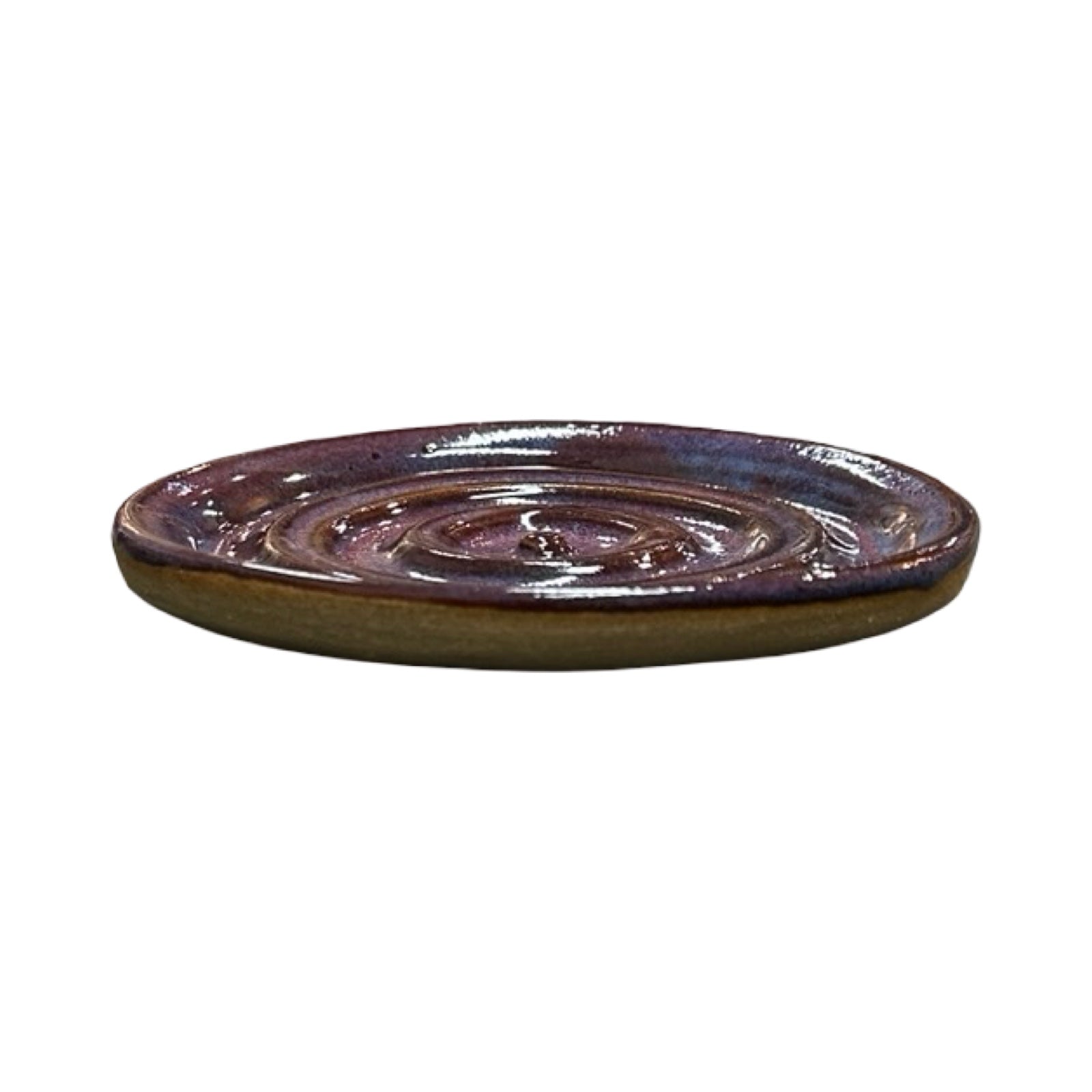 Ceramic dish with purple glaze on a white background.