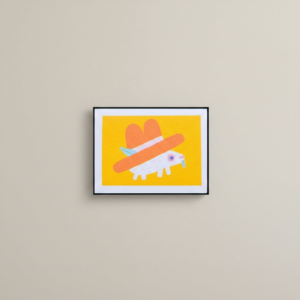 A risograph mini print of a hedgehog wearing a cowboy hat, framed on a wall.