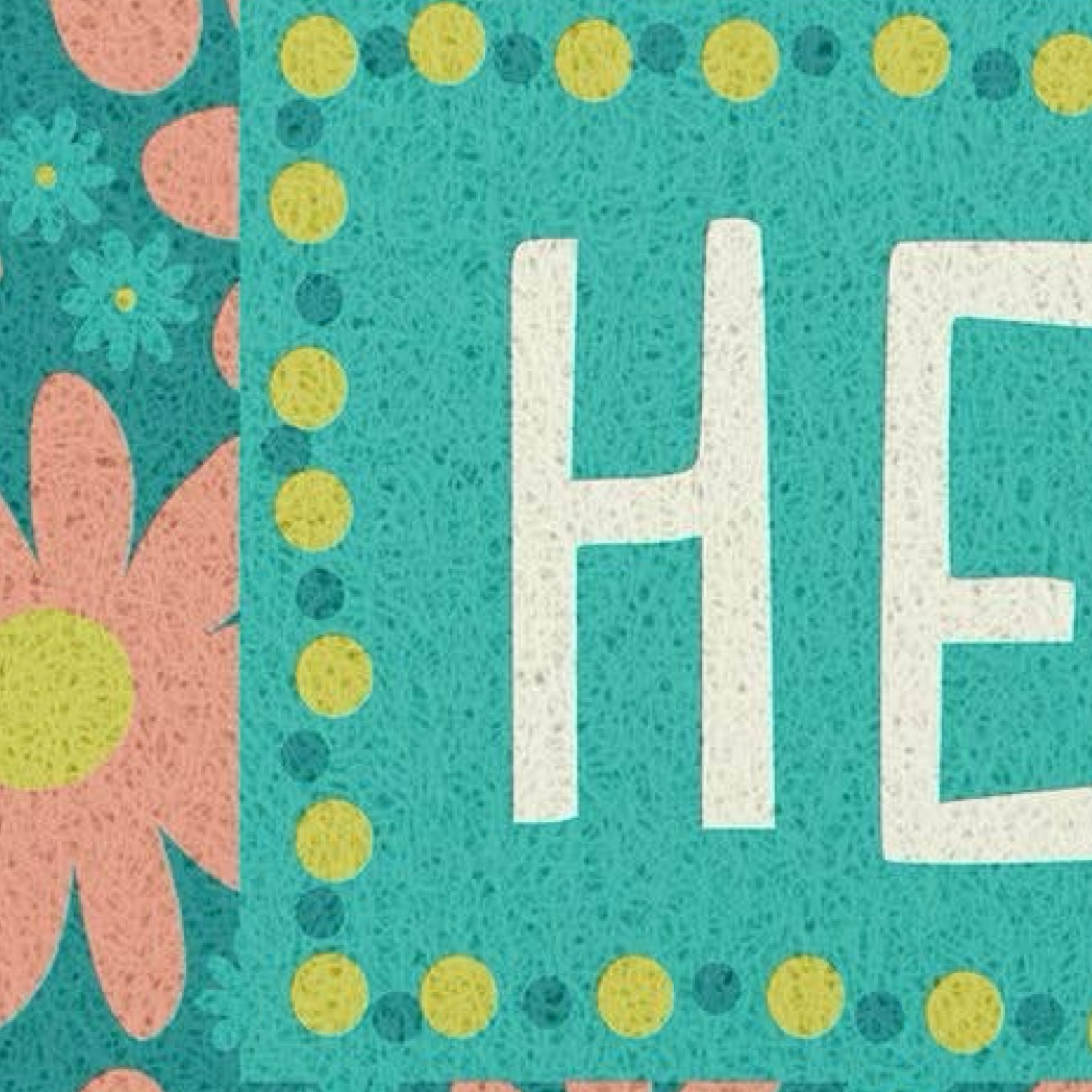 A close-up of a colorful patterned surface with large white letters 'HE' on a turquoise background, surrounded by yellow and teal dots, with pink flower shapes visible along the left edge.