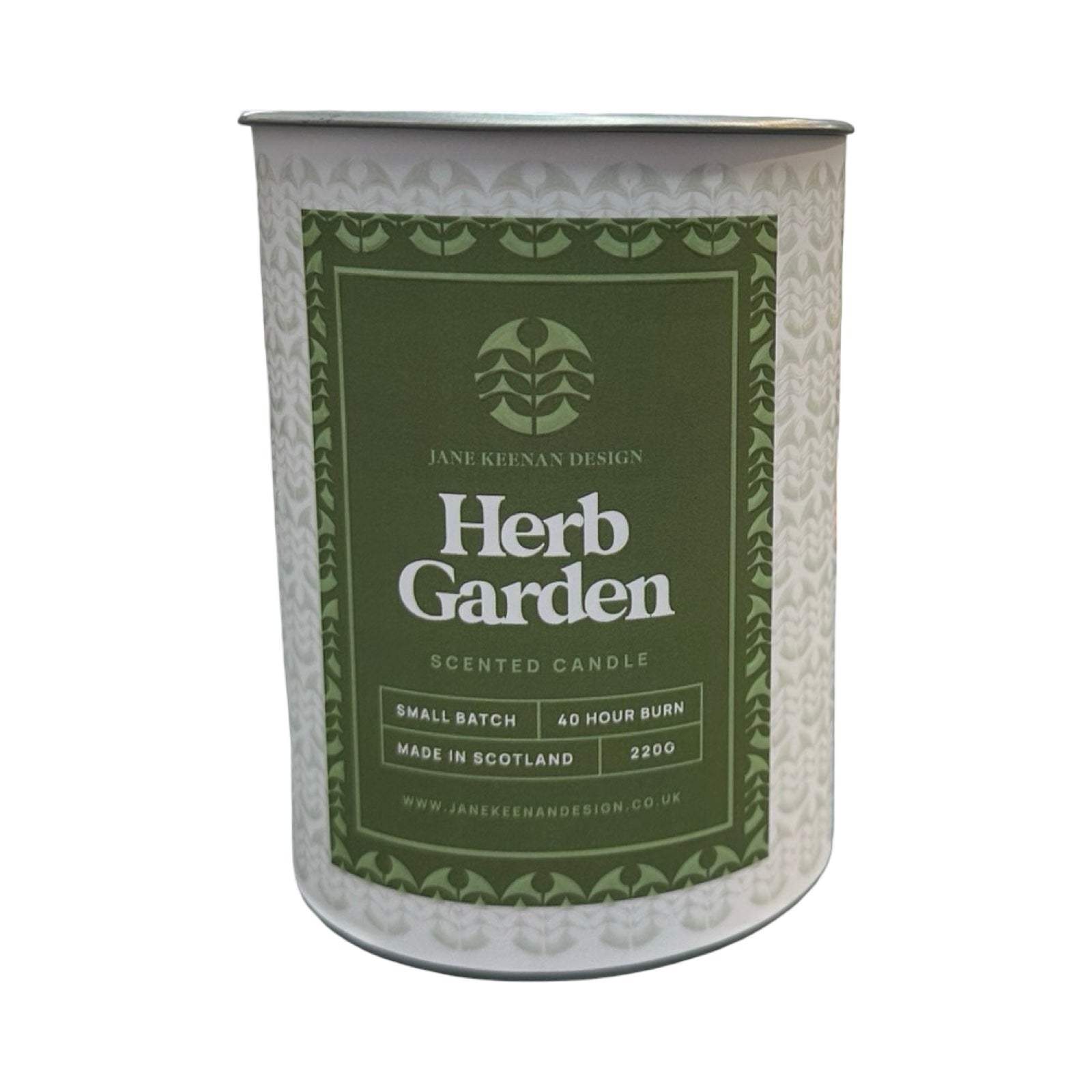 Scented candle container with 'Herb Garden' label on a white background.