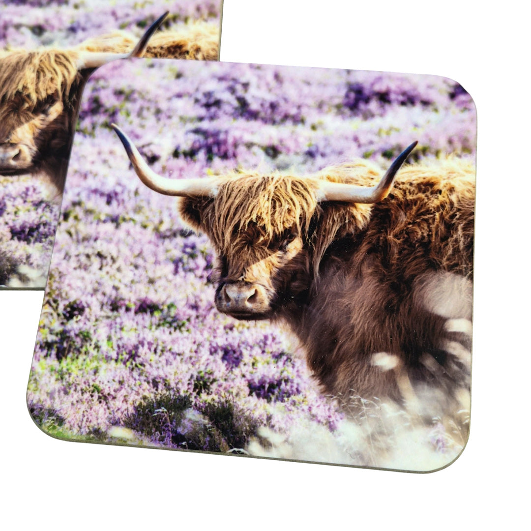 Highland cow in a field of purple flowers on a mouse pad