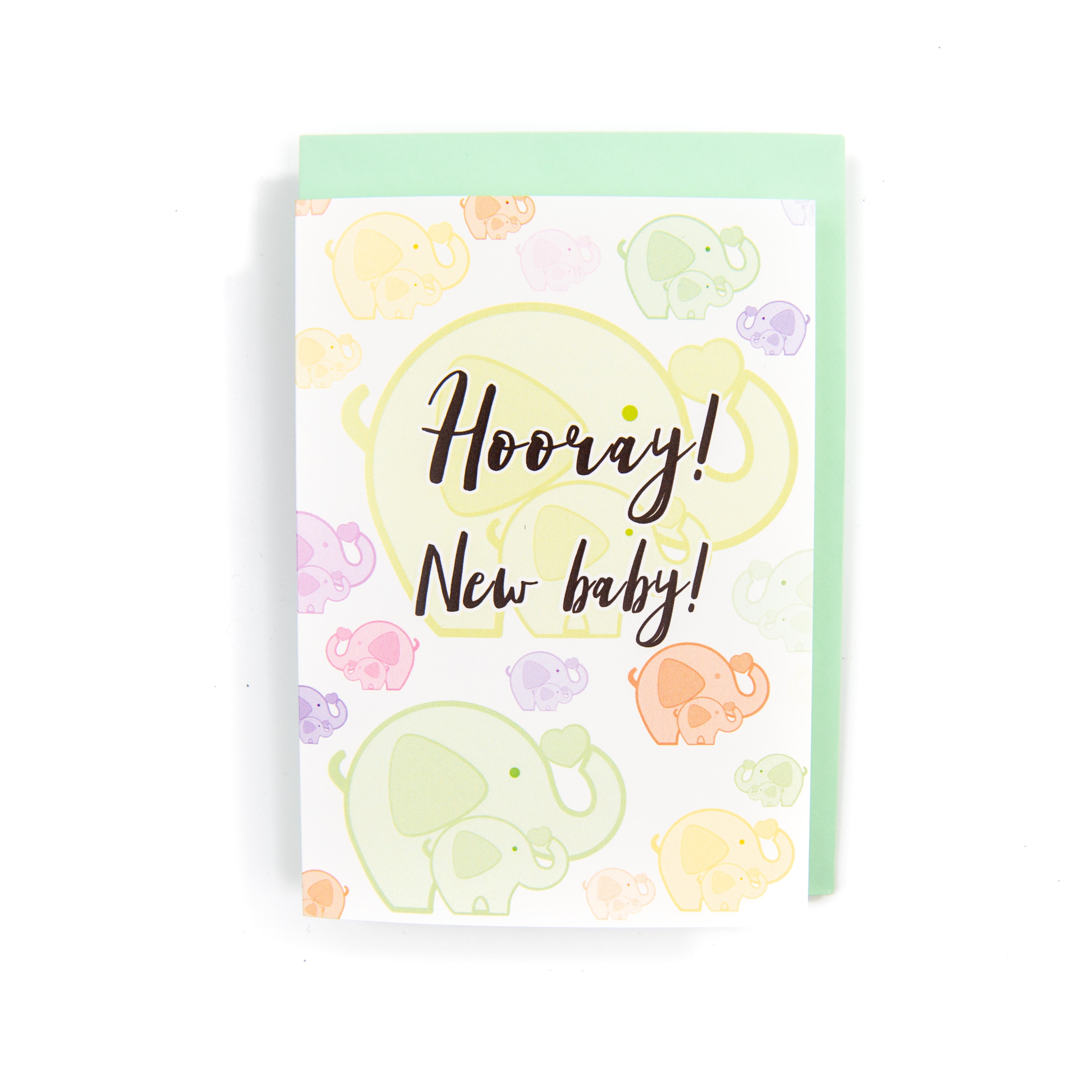 A colourful greeting card with illustrations of elephants and the text 'Hooray! New baby!' on the front, accompanied by an envelope.