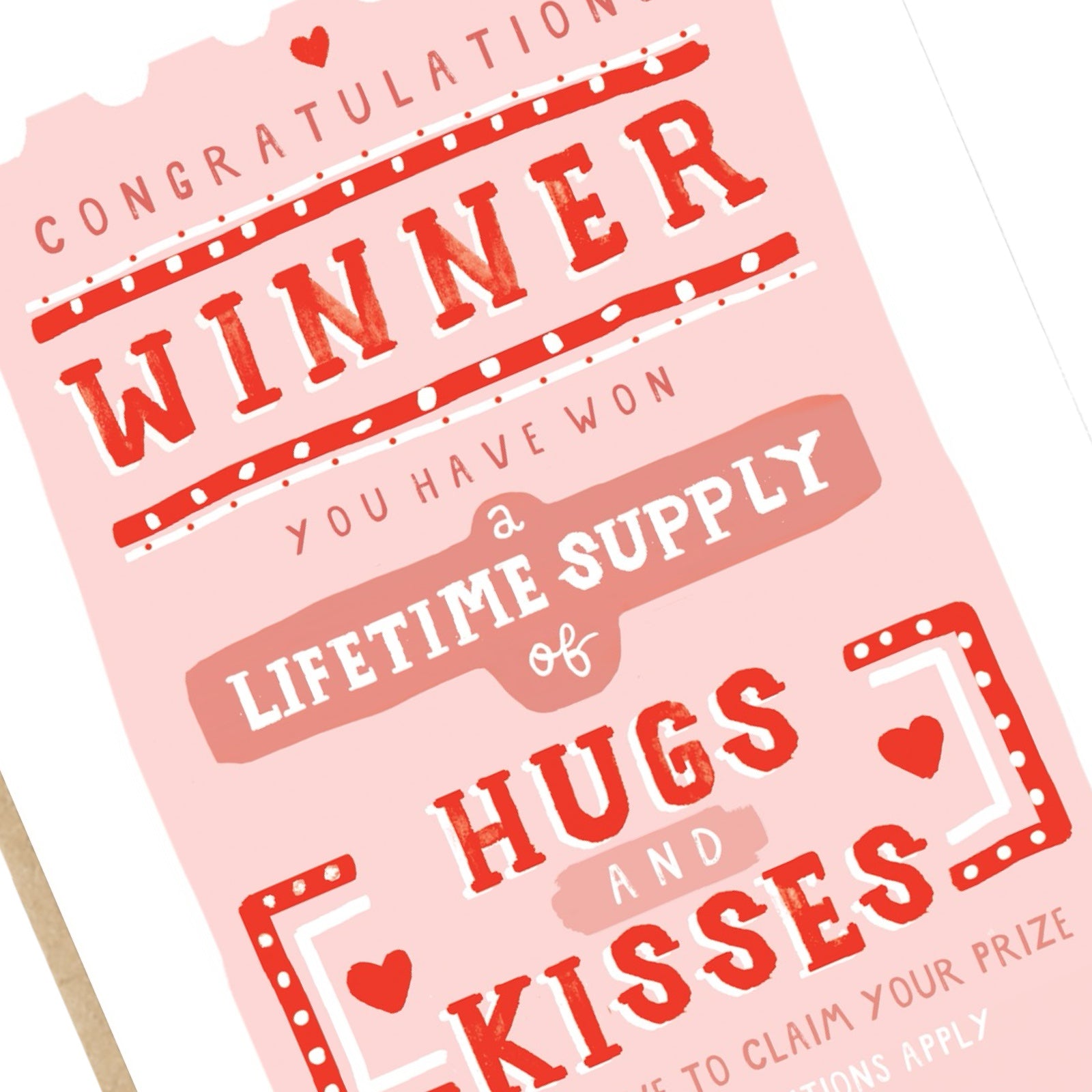 A card for the one you love featuring a pink vintage-style ticket with the text "Congratulations Winner, You Have won a Lifetime Supply of Hugs and Kisses". 