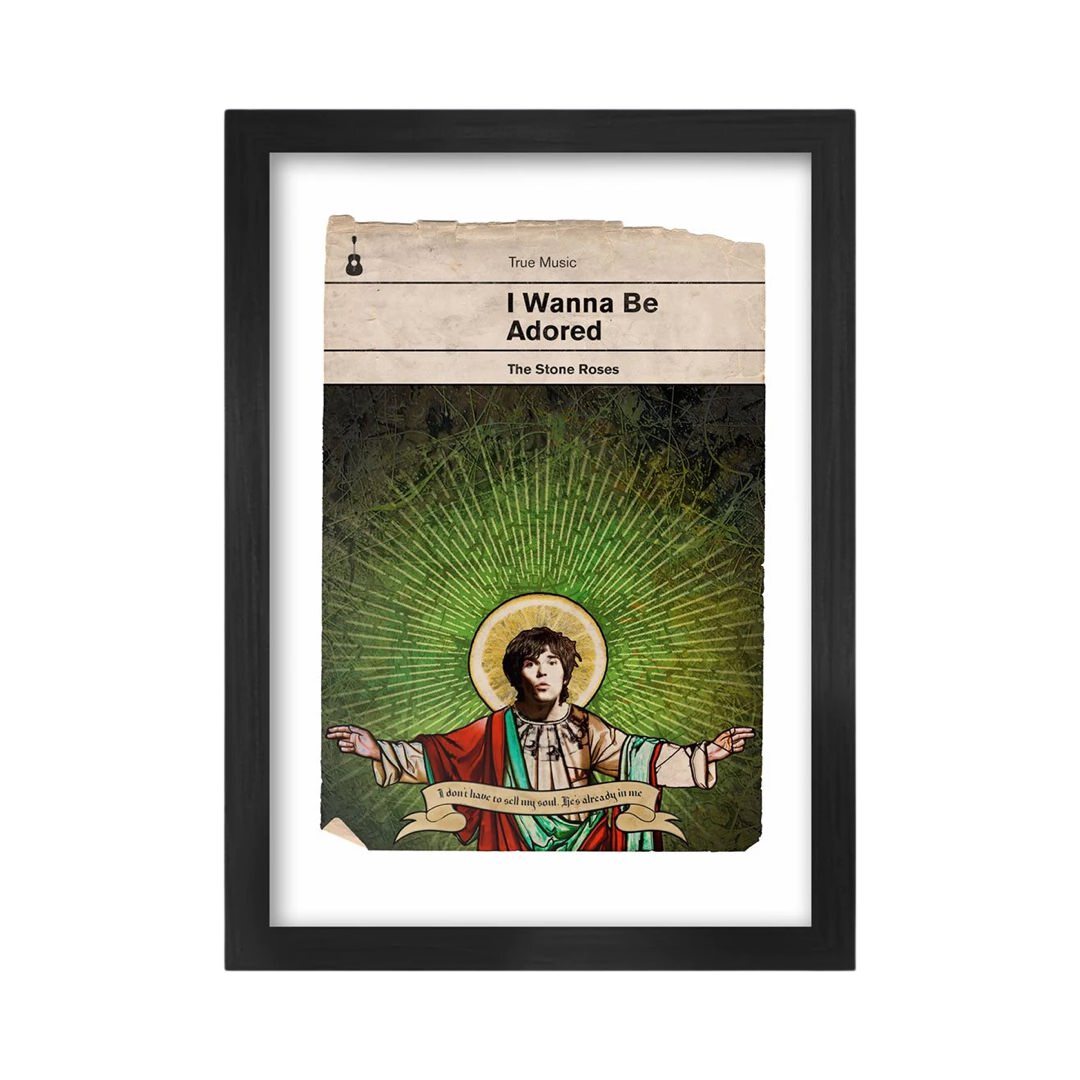 A framed A3 print featuring a book cover design with an illustration of a person resembling Ian Brown from the Stone Roses, titled 'I Wanna Be Adored'. The print is enclosed in a black frame.