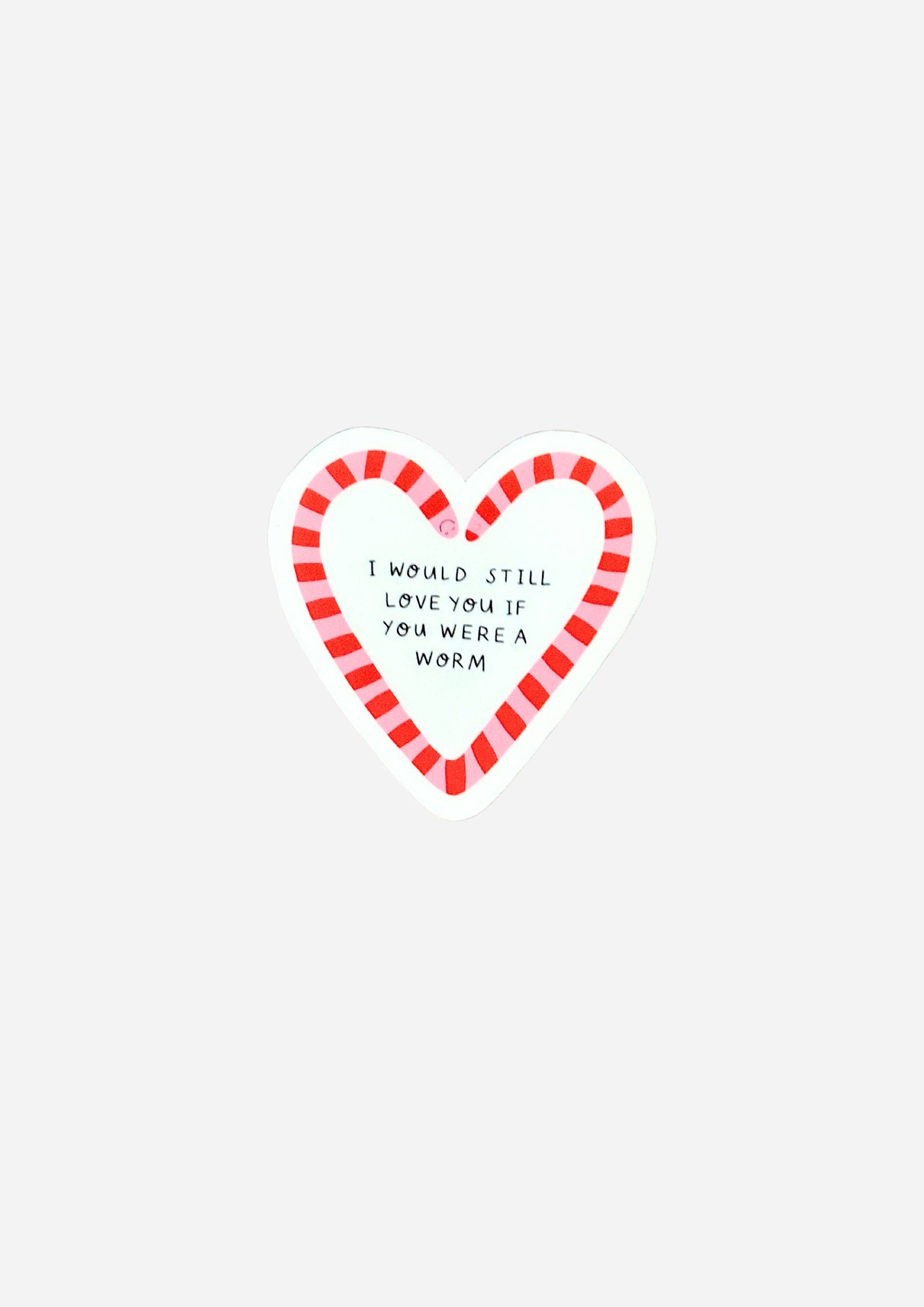 A heart-shaped sticker with a red and white striped border and the handwritten text 'I WOULD STILL LOVE YOU IF YOU WERE A WORM' in black, shown on a light grey background.