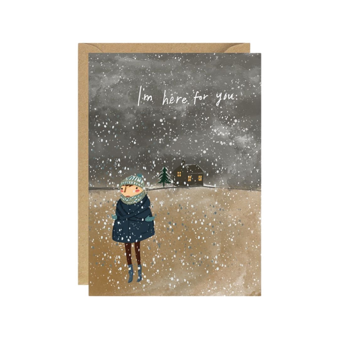 Friendship card featuring an illustration of a lady wrapped up in a coat, scarf and hat out walking in the snow and the text 'I'm here for you'.