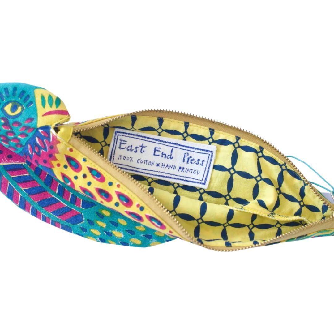 inside of colourful parrot shaped fabric zipper pouch showing yellow and blue checked lining.
