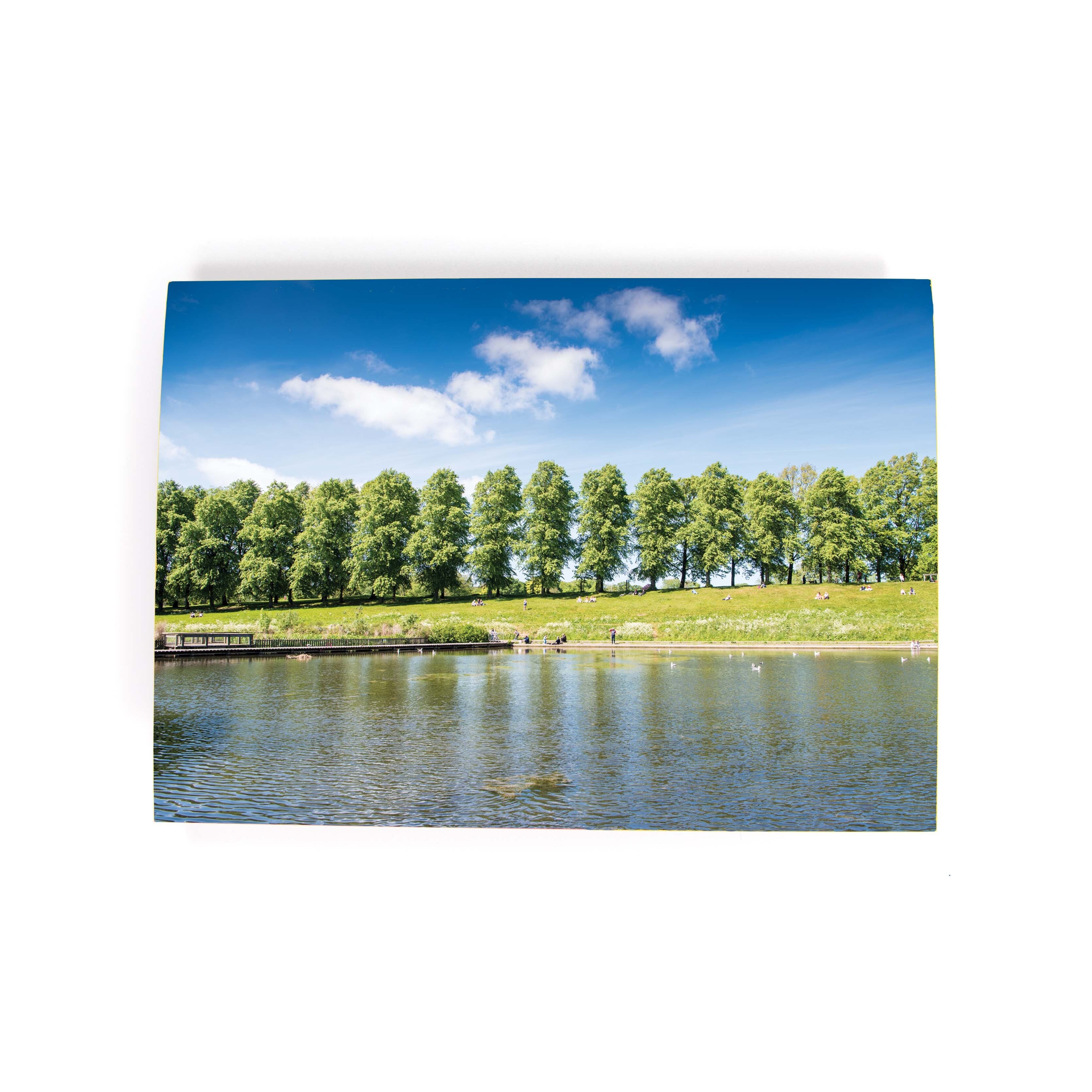 A greeting card featuring a landscape image of Inverleith Park with trees and water.
