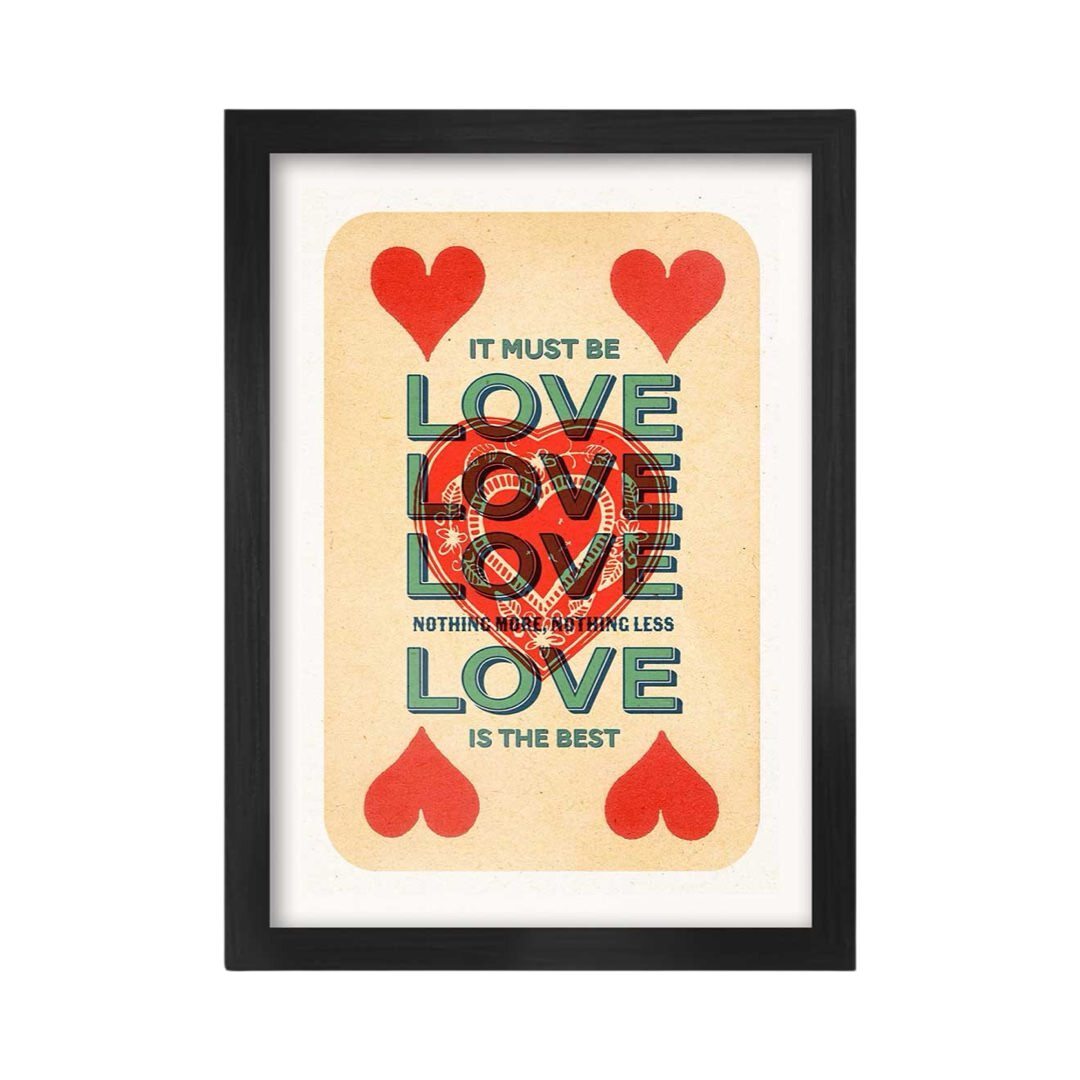 A framed A3 print featuring a red and white 'It must be love' text design on a background that resembles a playing card.