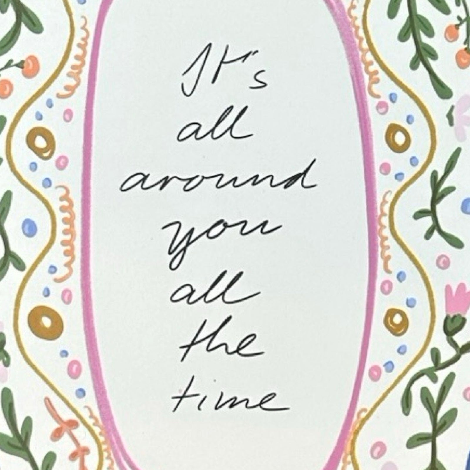 Motivational quote 'It's all around you all the time' with decorative border on a light background.
