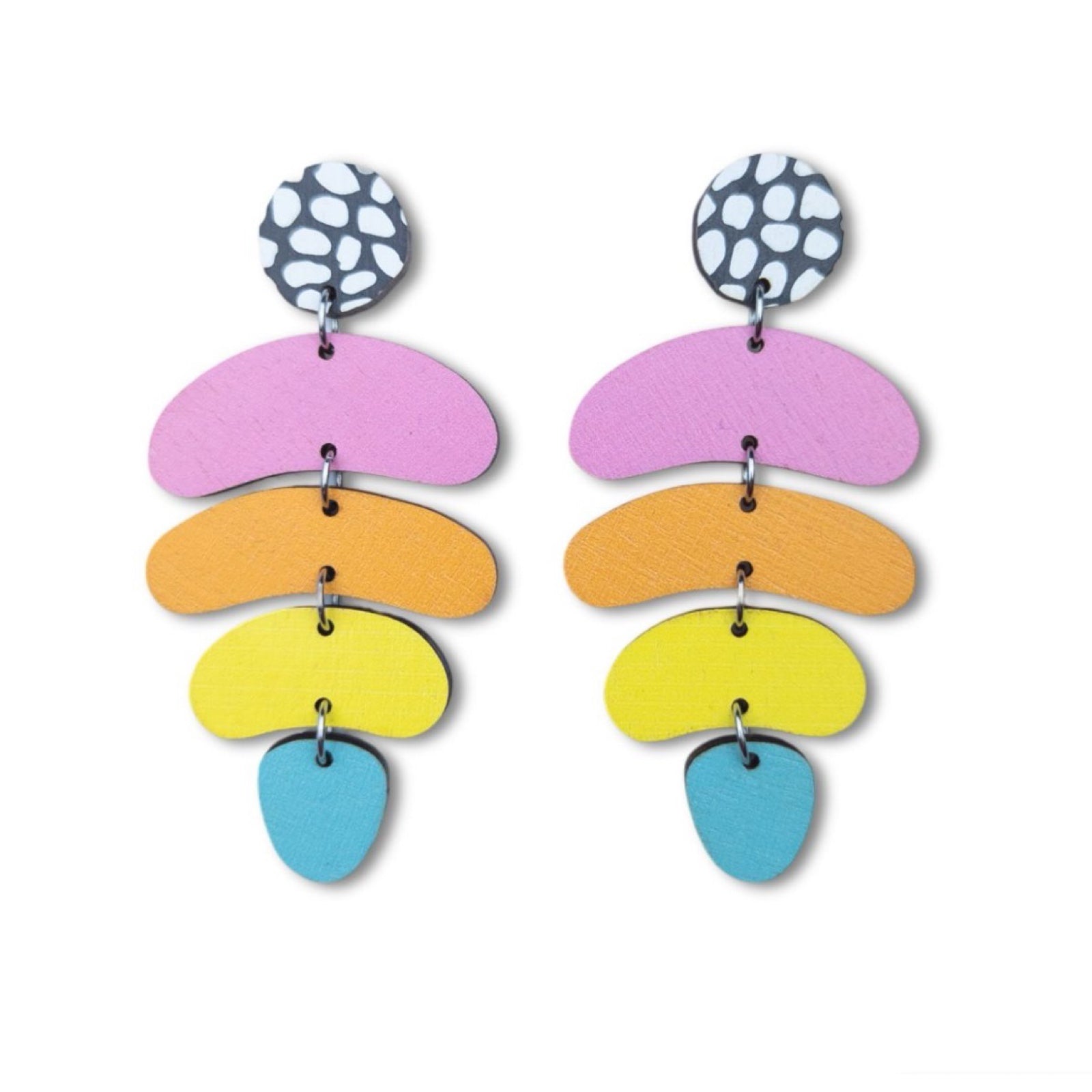 These wooden jellybean earrings feature a black and white pebble effect circular stud with pink, orange, yellow and teal jellybean shapes hanging underneath.