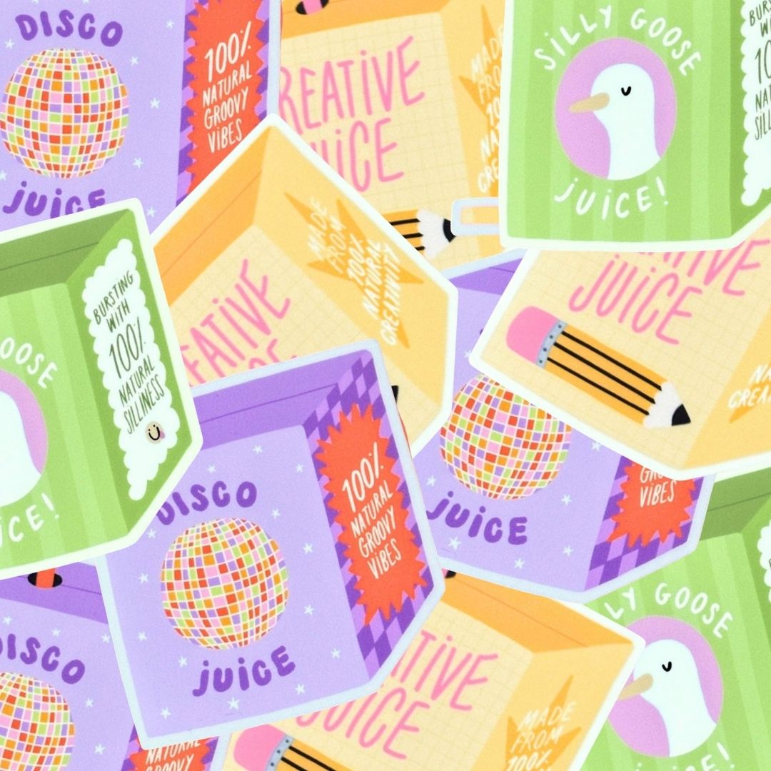 Pile of juice box stickers in green, yellow and purple.