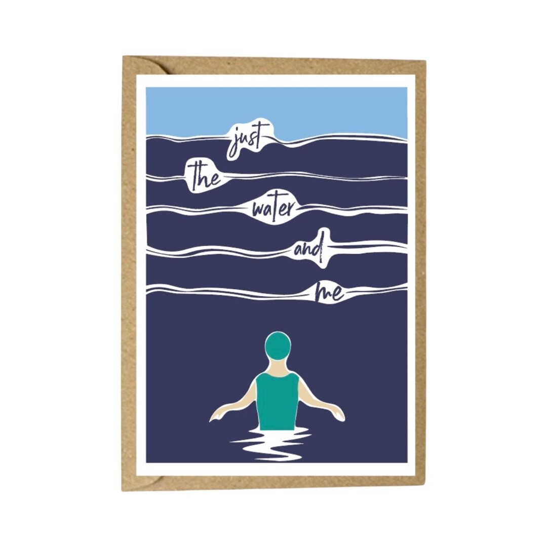 Art card featuring a female wild swimmer in a turquoise swimsuit and swim cap standing waist-high in the sea with the text "just the water and me".