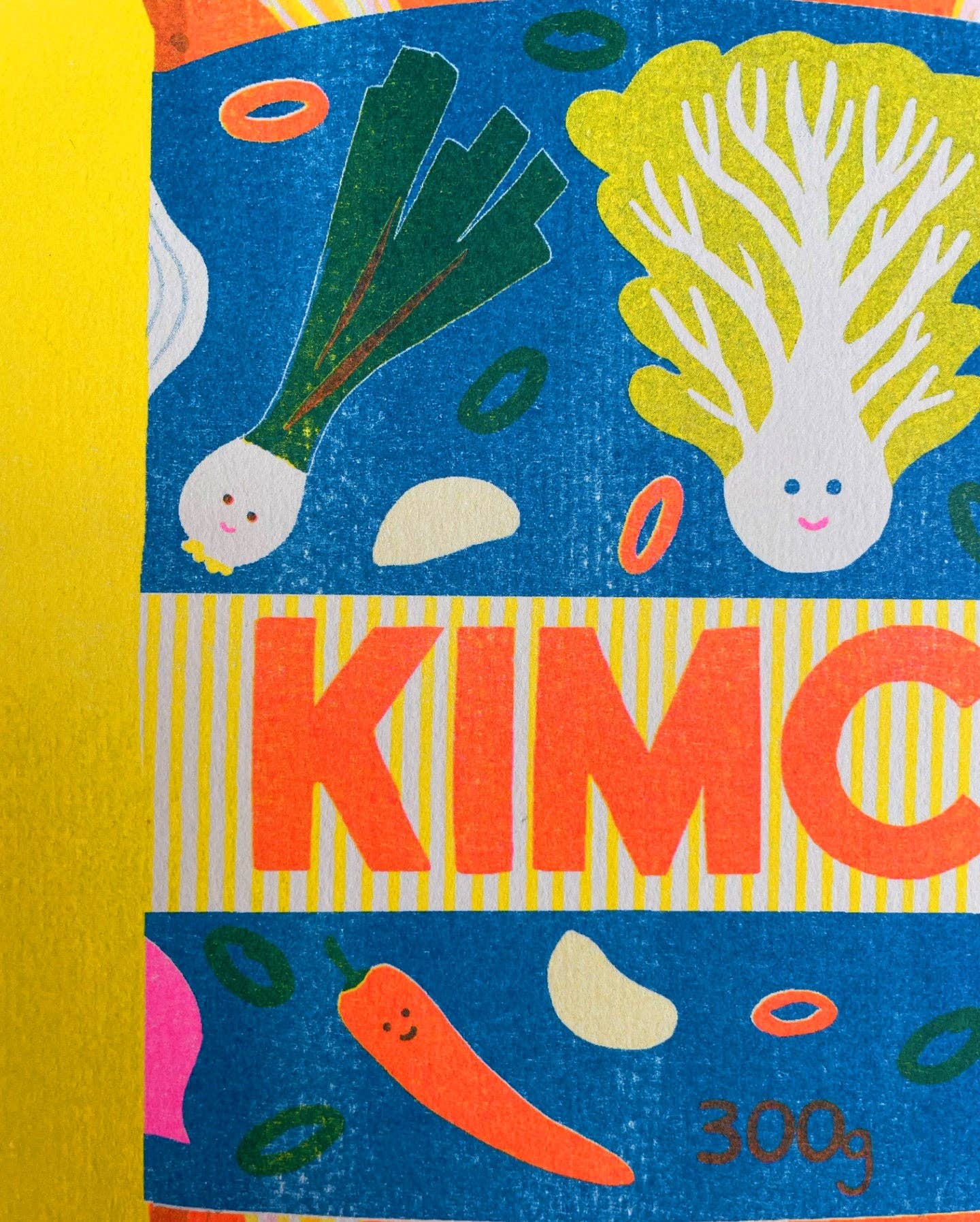 This colourful risograph print features a jar of kimchi against a yellow background.