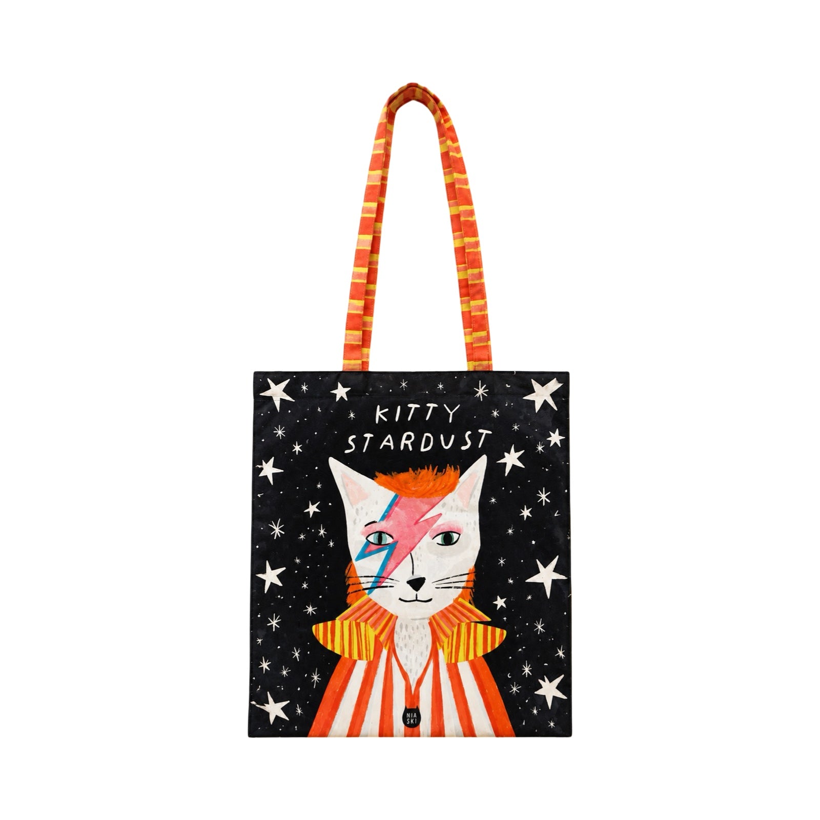 A tote bag featuring an illustration of a white cat dressed as David Bowie with the text 'KITTY STARDUST' on a black starry background, with orange and white striped handles.